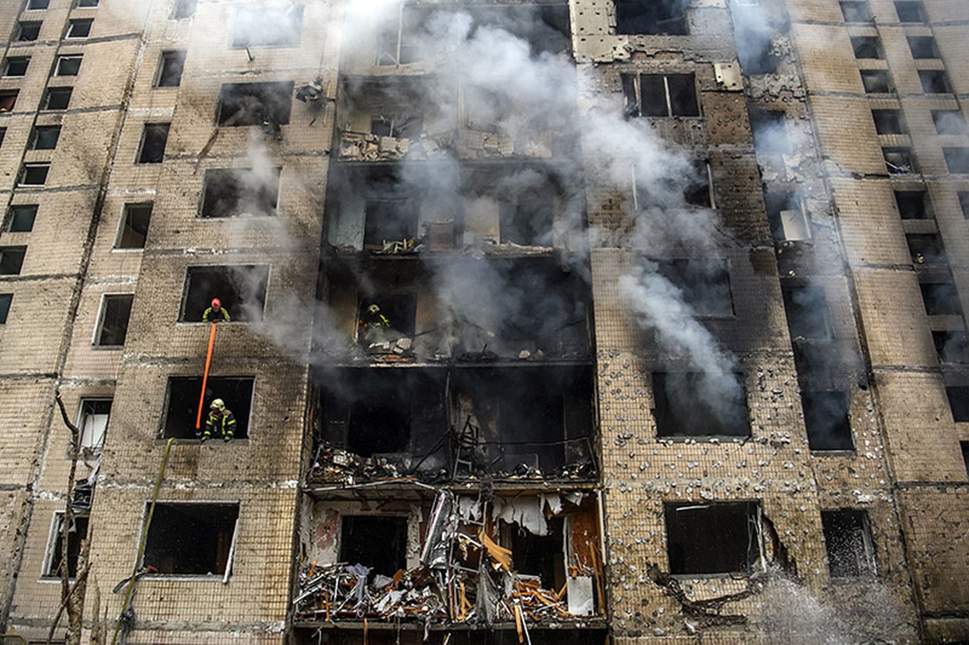 Firefighters are working at the site of a residential building that was heavily damaged during a Russian missile attack this morning in Kyiv, Ukraine, on January 2, 2024.