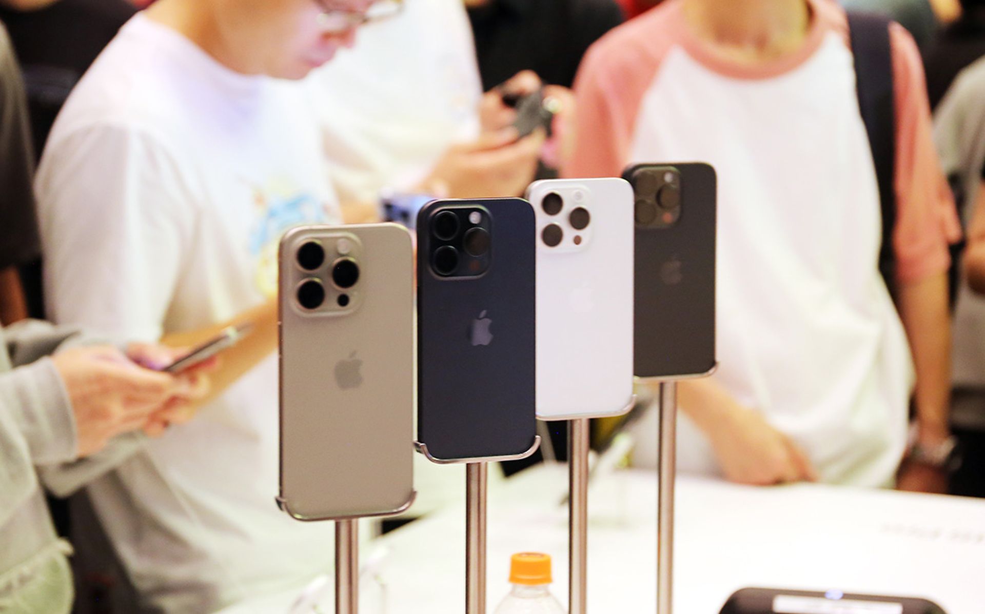 Customers check out the newly launched iPhone 15 at Apple's flagship store in Shanghai, China, on September 24, 2023. (Photo by Costfoto/NurPhoto via Getty Images)