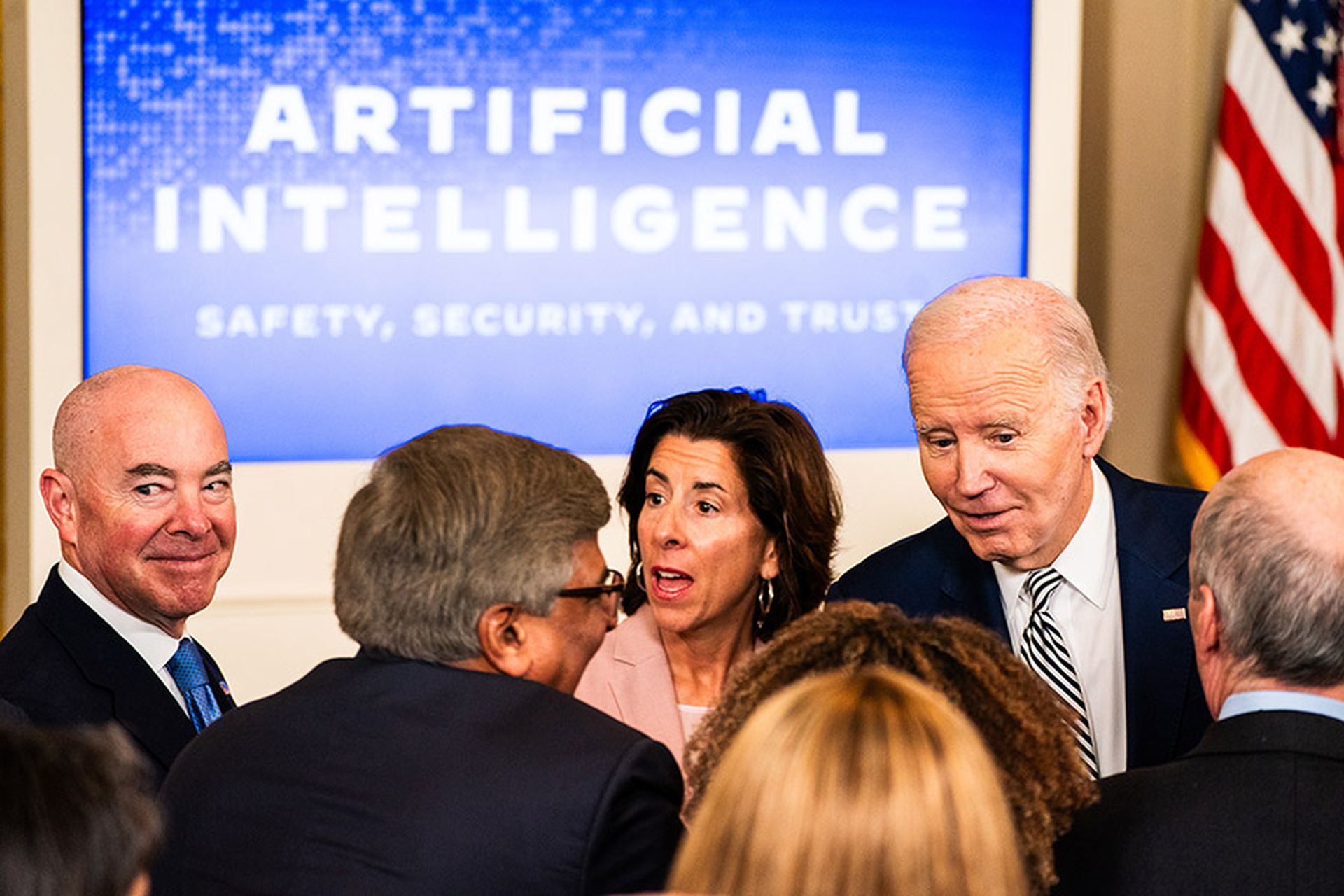 President Joe Biden chats with guests during an event