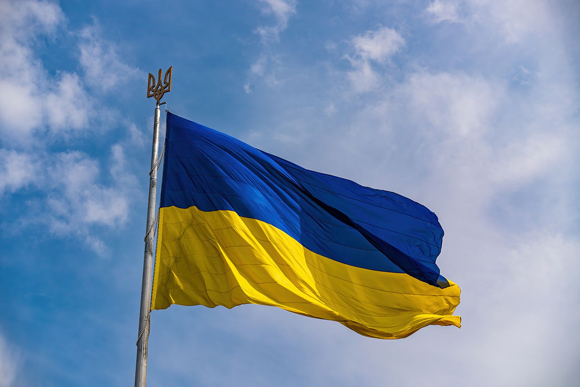 Ukrainian national official flag on blue sky background