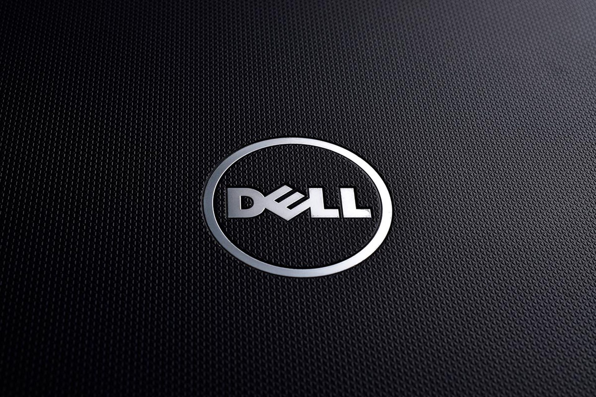 Dell logo on textured black laptop, close up