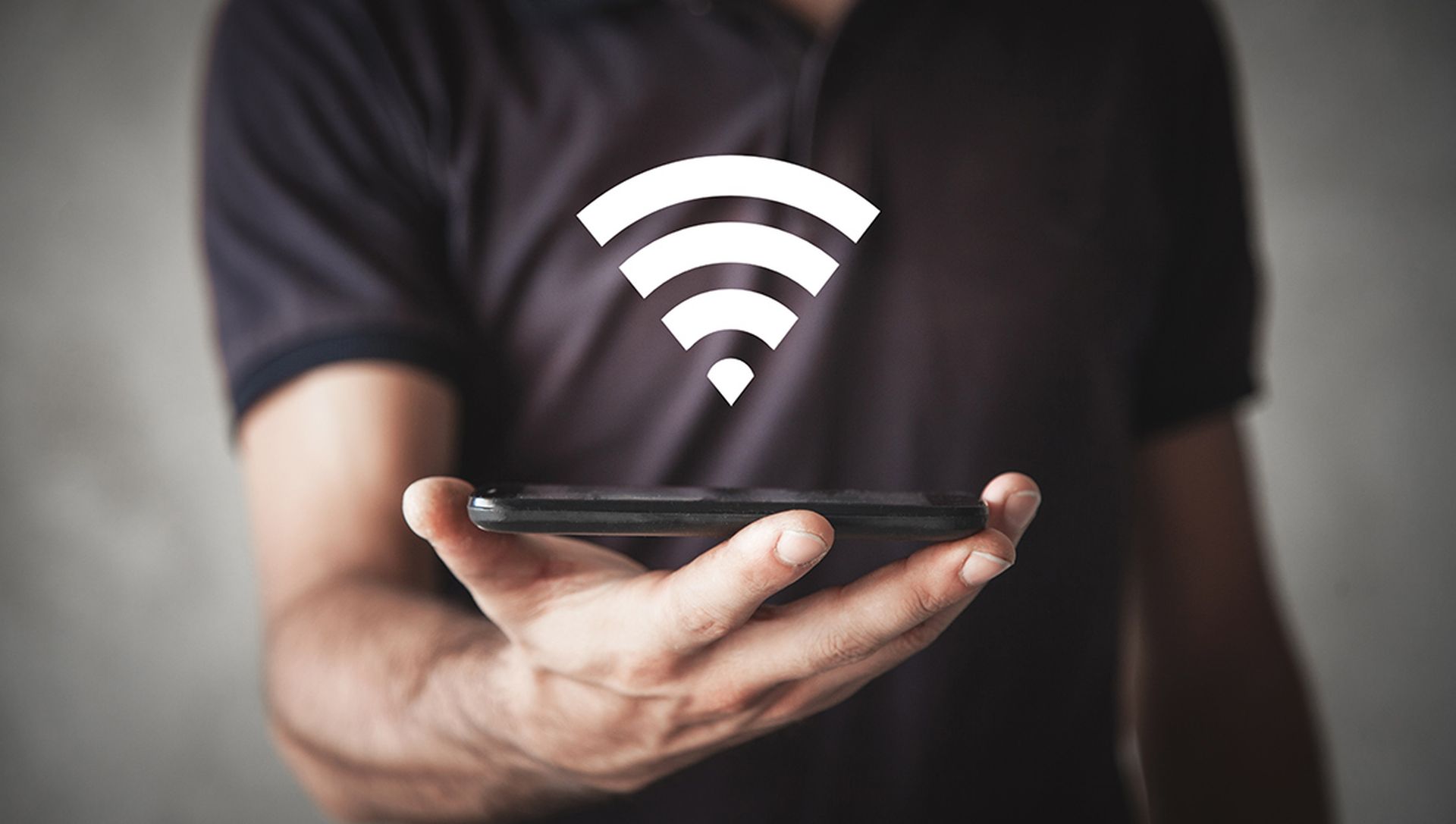 Man holding smartphone with wi-fi sign. Internet, Technology