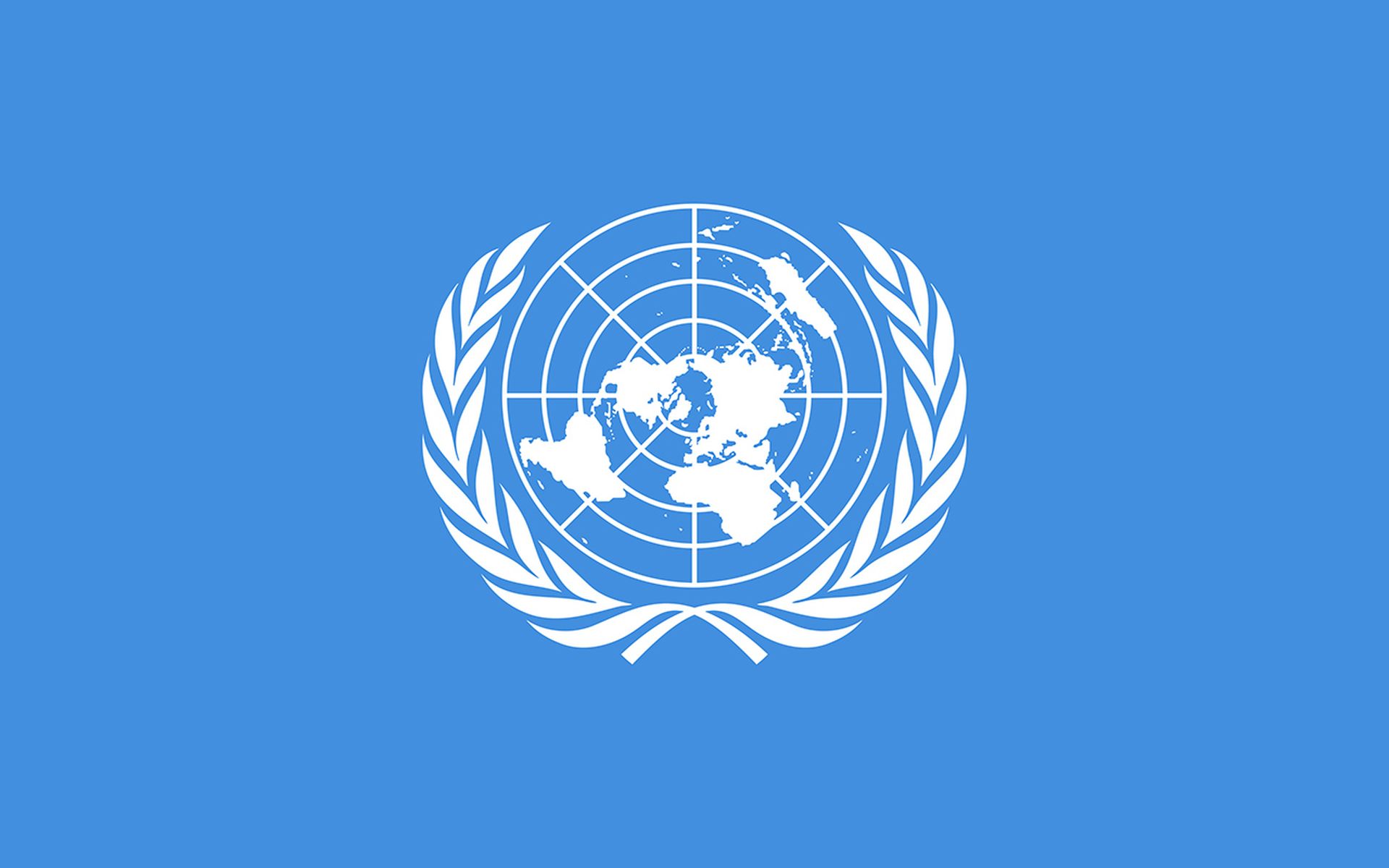 Flag of United Nations (UN), international territory, white UN emblem - polar azimuthal equidistant projection world map surrounded by two olive branches - on a blue background