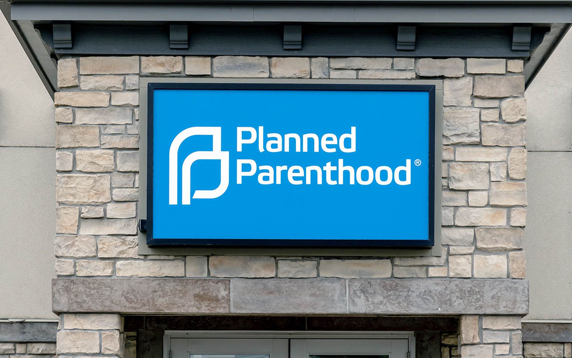 Planned Parenthood clinic exterior and trademark logo.