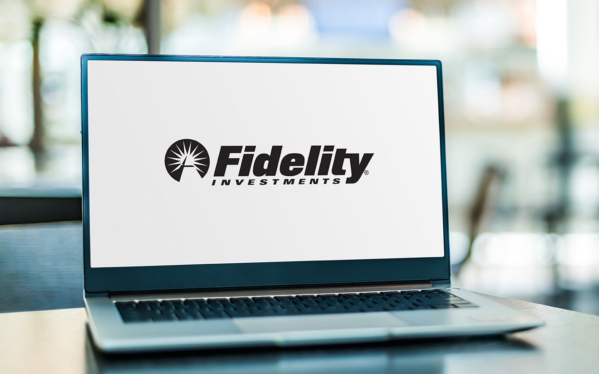 Laptop computer displaying logo of Fidelity, an American multinational financial services corporation based in Boston, Massachusetts