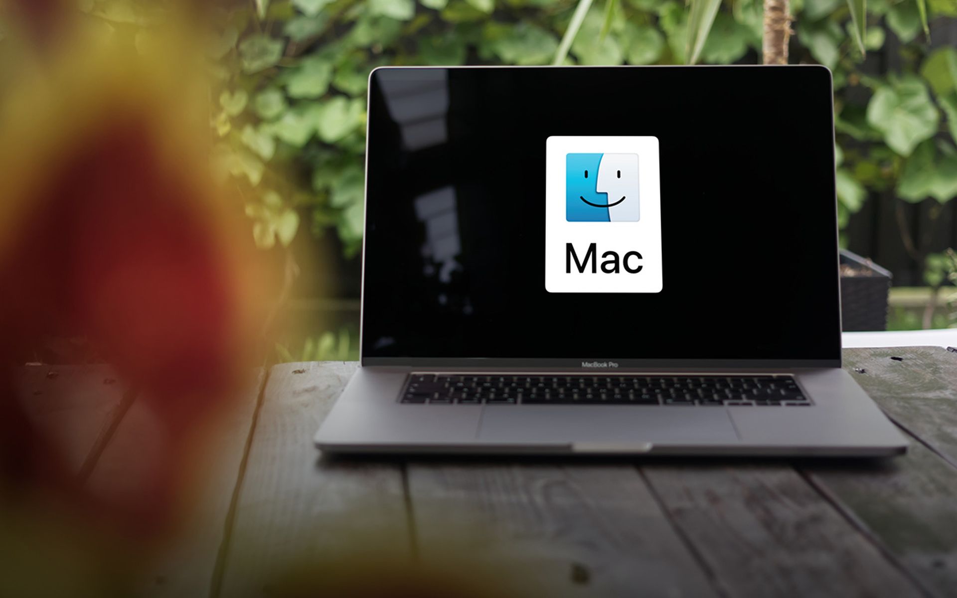 MacOS logo (Mac OS X), an operating system developed by Apple Inc., displayed on a MacBook Pro screen