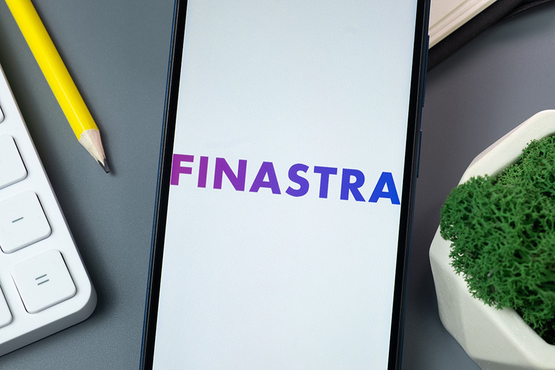 Finastra Logo on Phone Screen, Company Icon on Display.