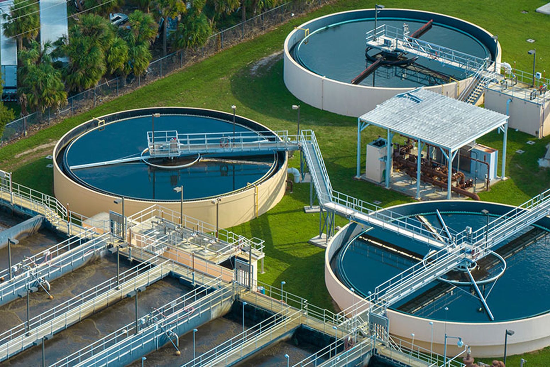 Aerial view of water treatment factory at city wastewater cleaning facility. Purification process of removing undesirable chemicals, suspended solids and gases from contaminated liquid.