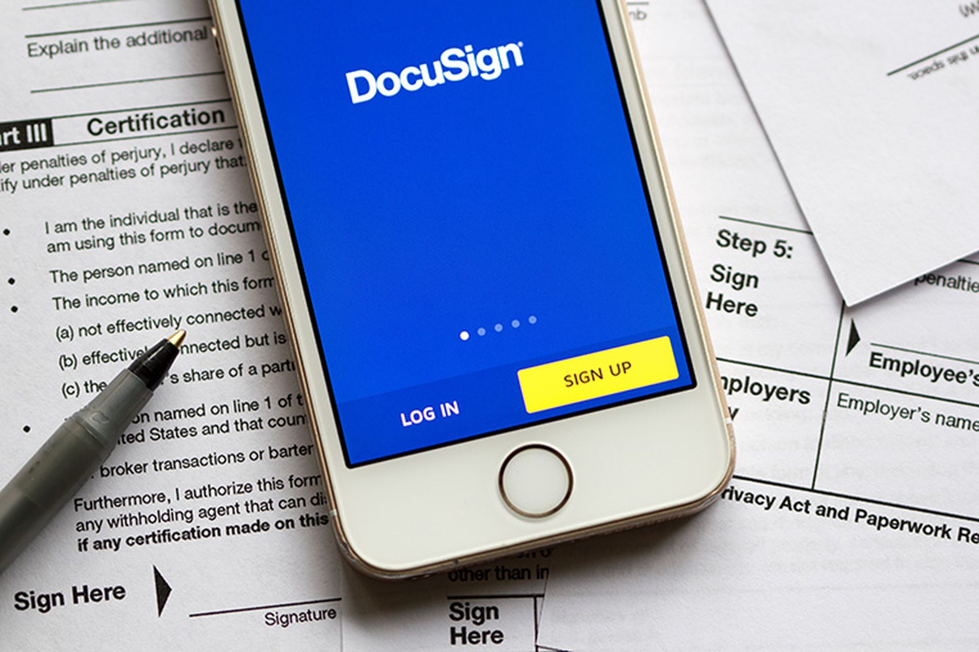 DocuSign mobile app login page is seen on a smartphone.