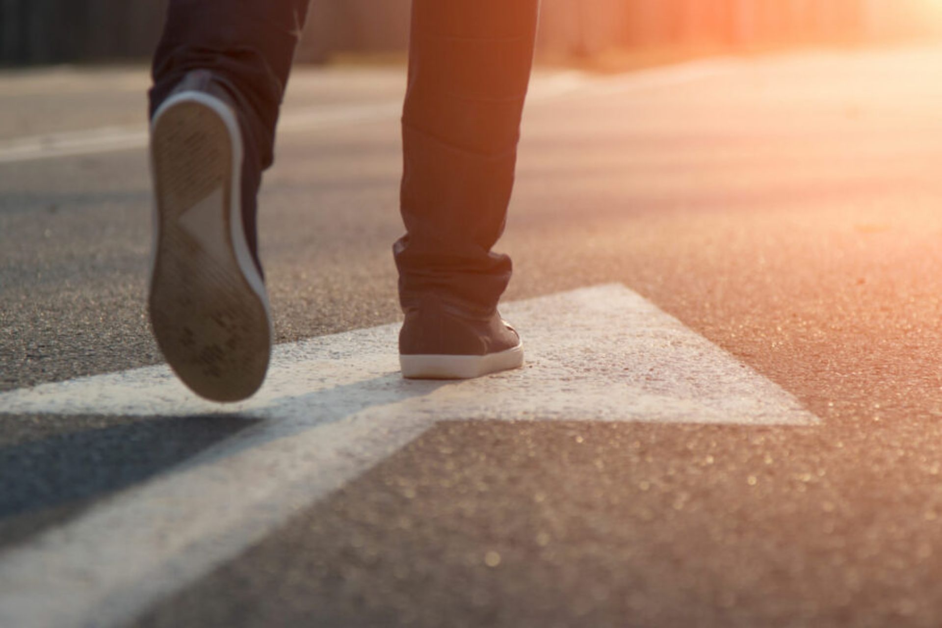 Female walk in blue Sneakers And Arrow (Adobe Stock)