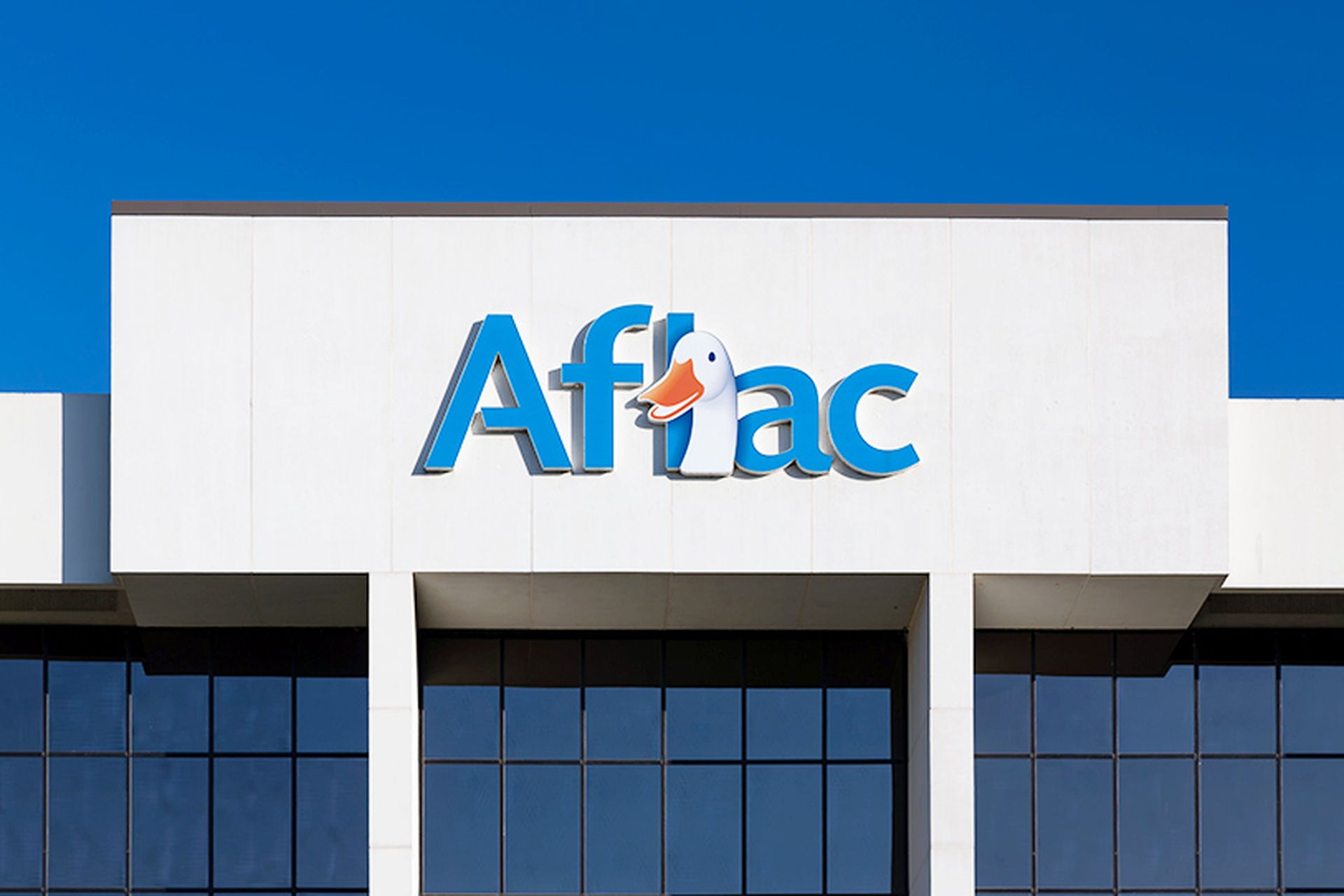 Aflac Insurance corporate building and trademark logo. American Family Life Assurance Company is an American insurance company.
