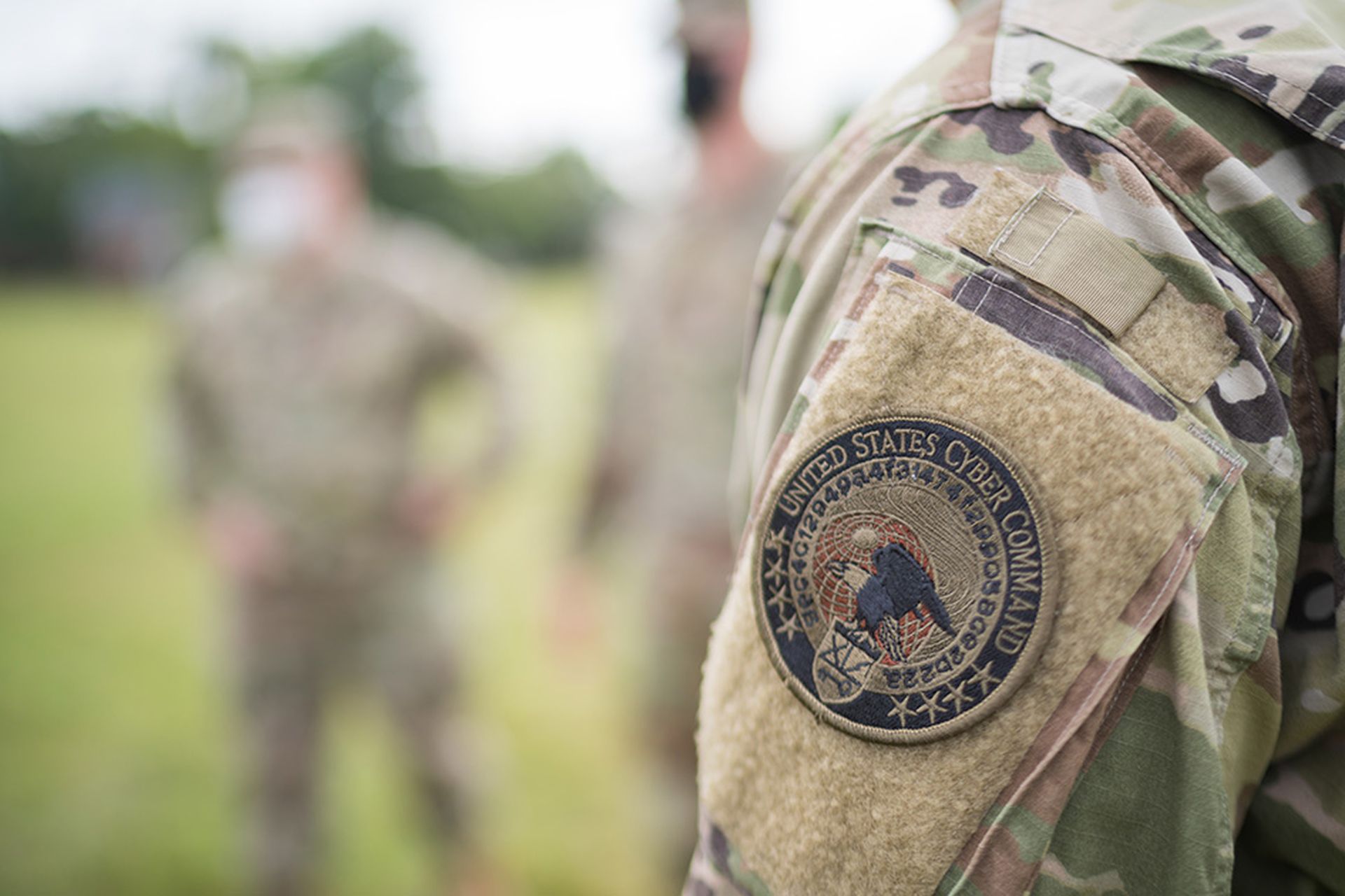 A member of the 110th Information Operations Battalion, Maryland National Guard, displays his U.S. Cyber Command patch July 22, 2020, at Fort Meade, Maryland. The members of the 110th IO Bn. worked closely with the U.S. Cyber Command’s Cyber National Mission Force to protect the election process by countering adversarial bad actors throughout 2020. (U.S. Army National Guard Photo by Sgt. 1st Class Thaddeus Harrington)