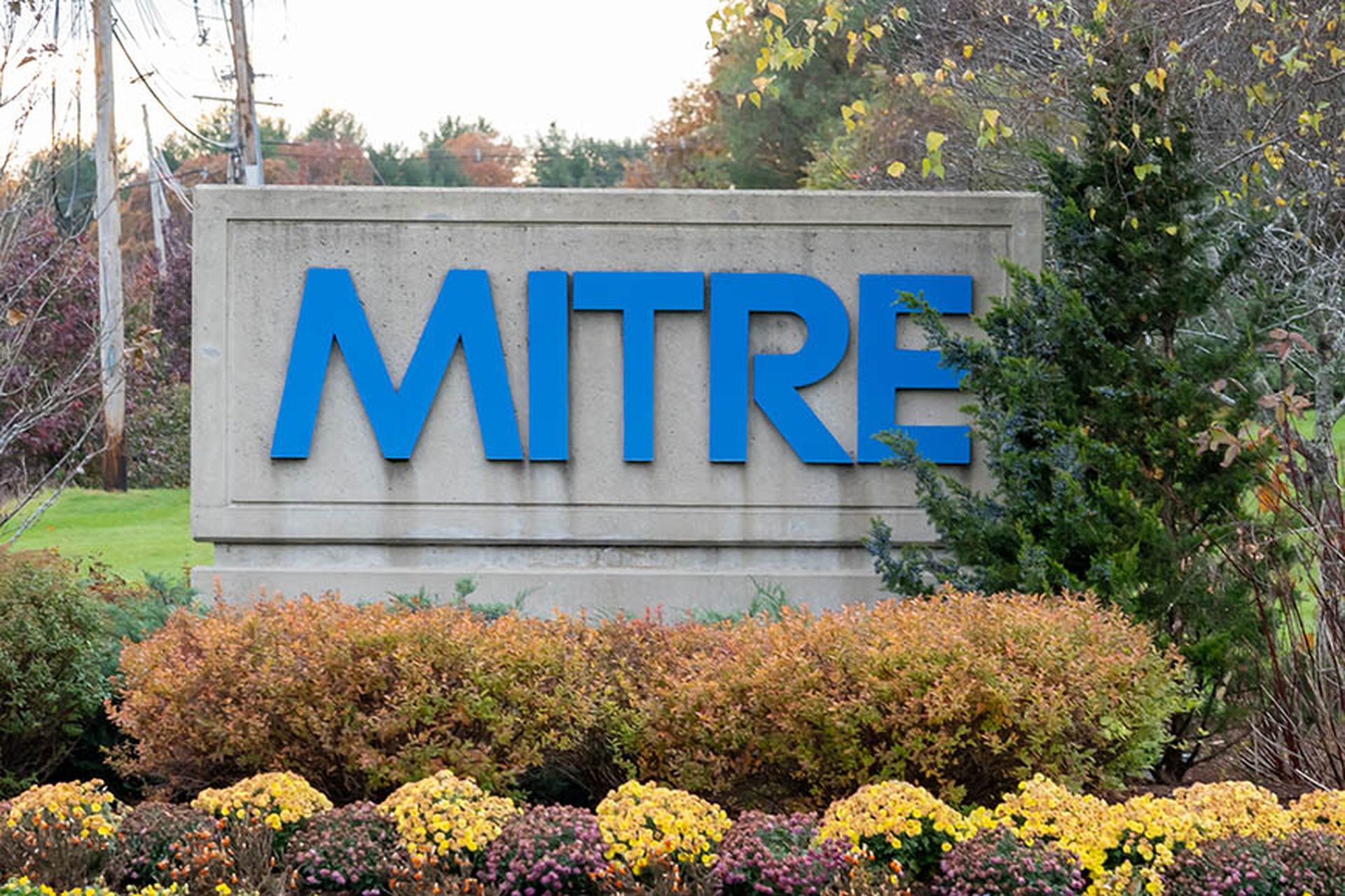 MITRE sign at its headquarters at Bedford Campus in Bedford, MA, USA. The Mitre Corporation is an American not-for-profit organization.