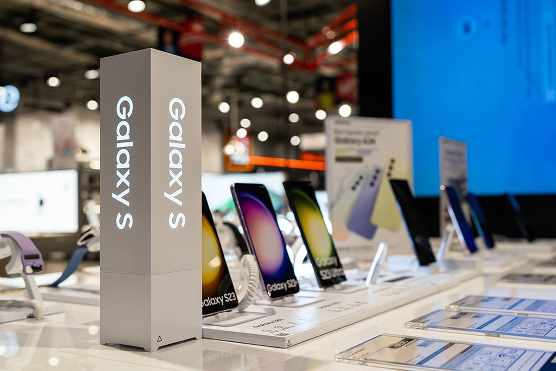 New Samsung Galaxy mobile smartphones is shown on retail display inside electronics store.