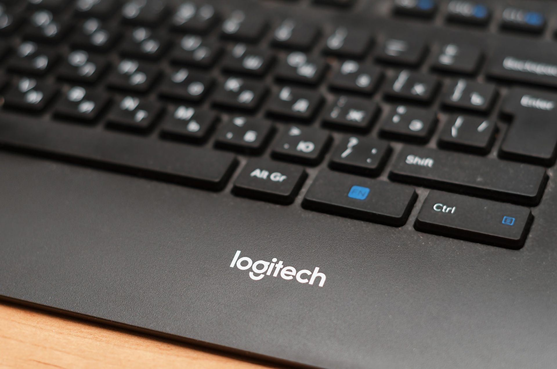 black logitech computer keyboard with russian and english letters