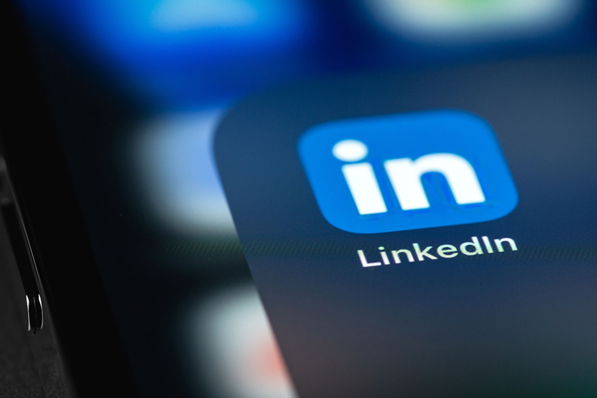 LinkedIn mobile icon app on screen smartphone iPhone closeup. LinkedIn is a social network for finding and establishing business contacts.
