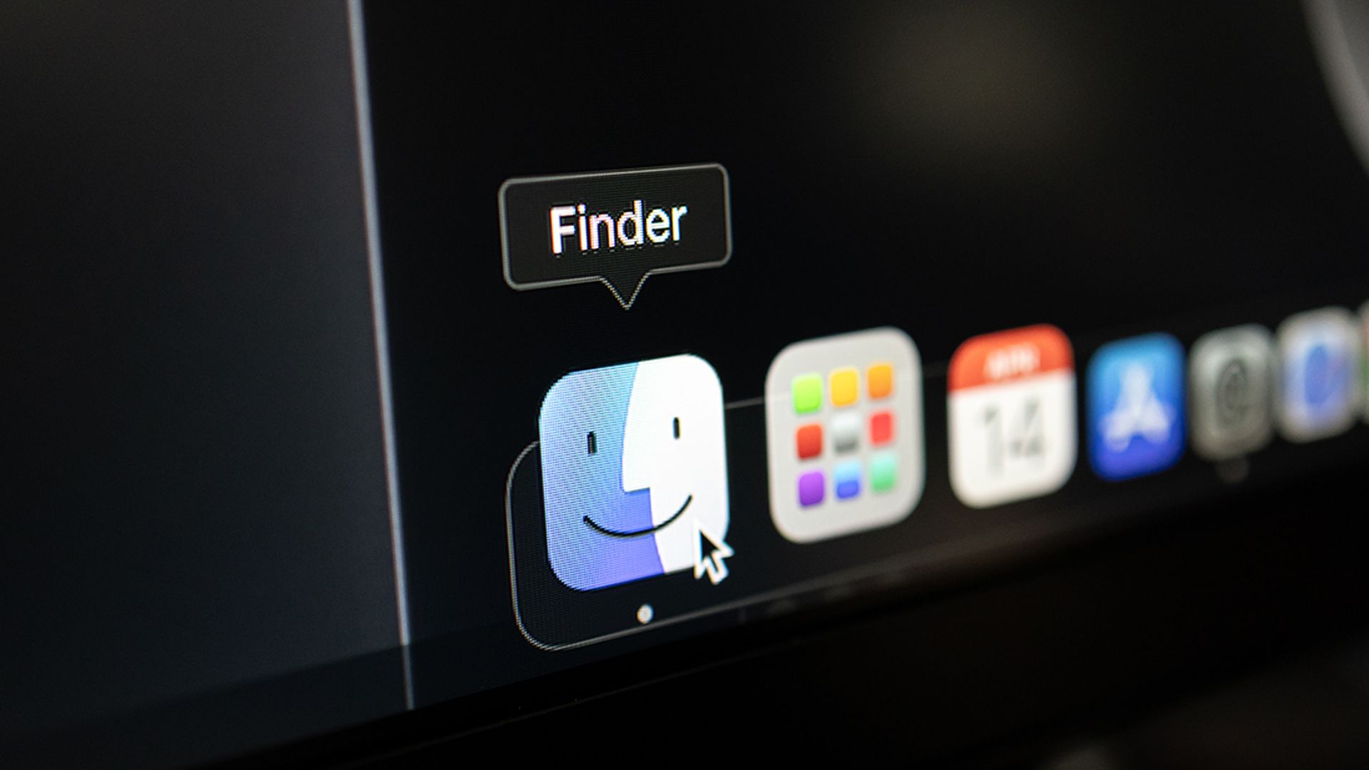 Close-up of Apple MacOS Dock with Finder icon selected and mouse cursor hovering