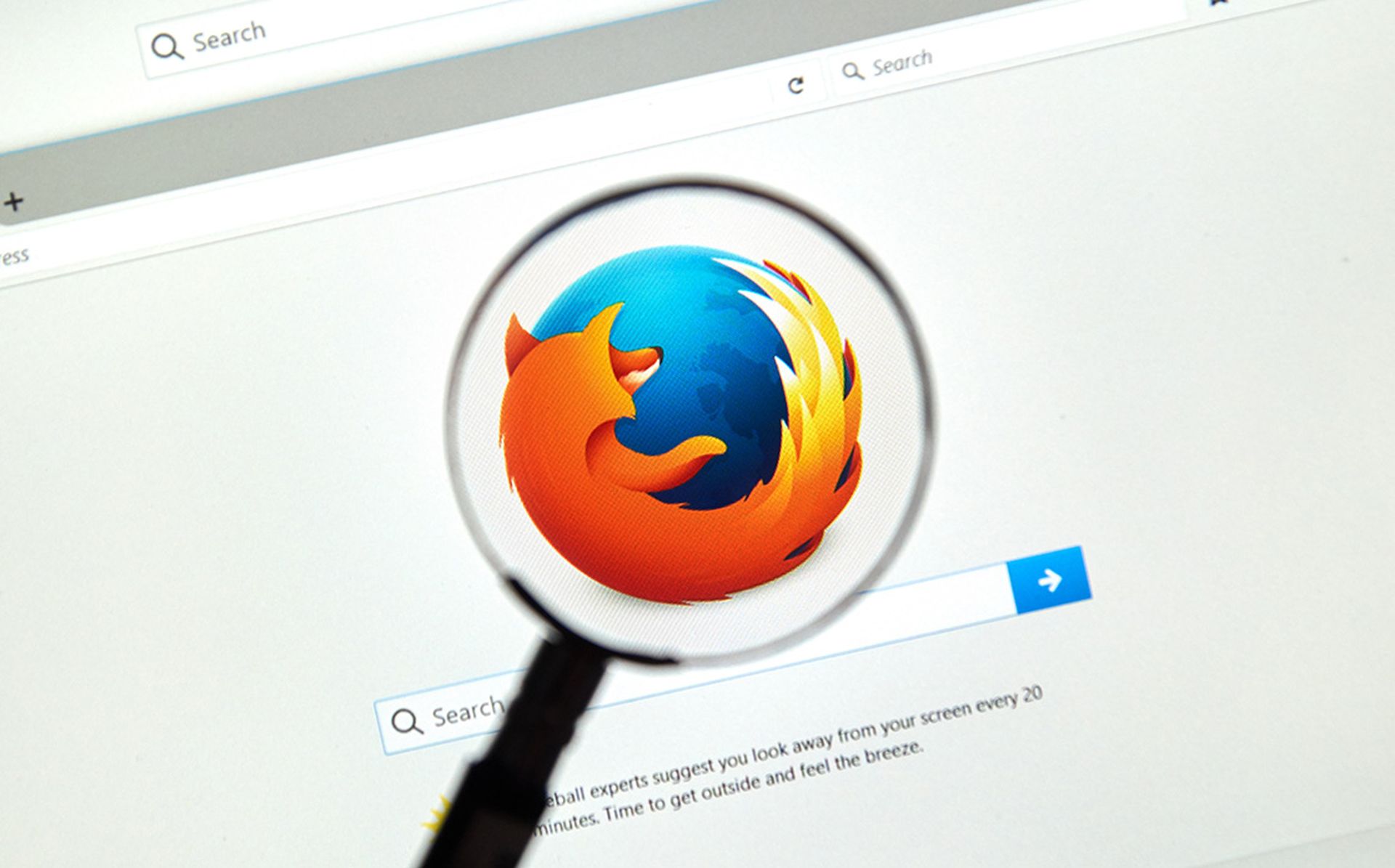 Firefox web browser under magnifying glass. Firefox is a free and open-source web browser developed by the Mozilla Foundation.