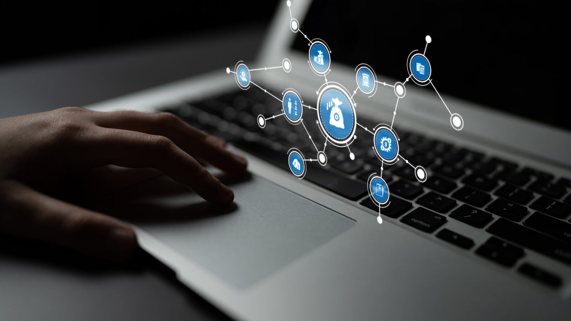 This image captures a modern workspace where digital security is highlighted, featuring a hand on a laptop keyboard with security icons representing connectivity and protection. Tessel