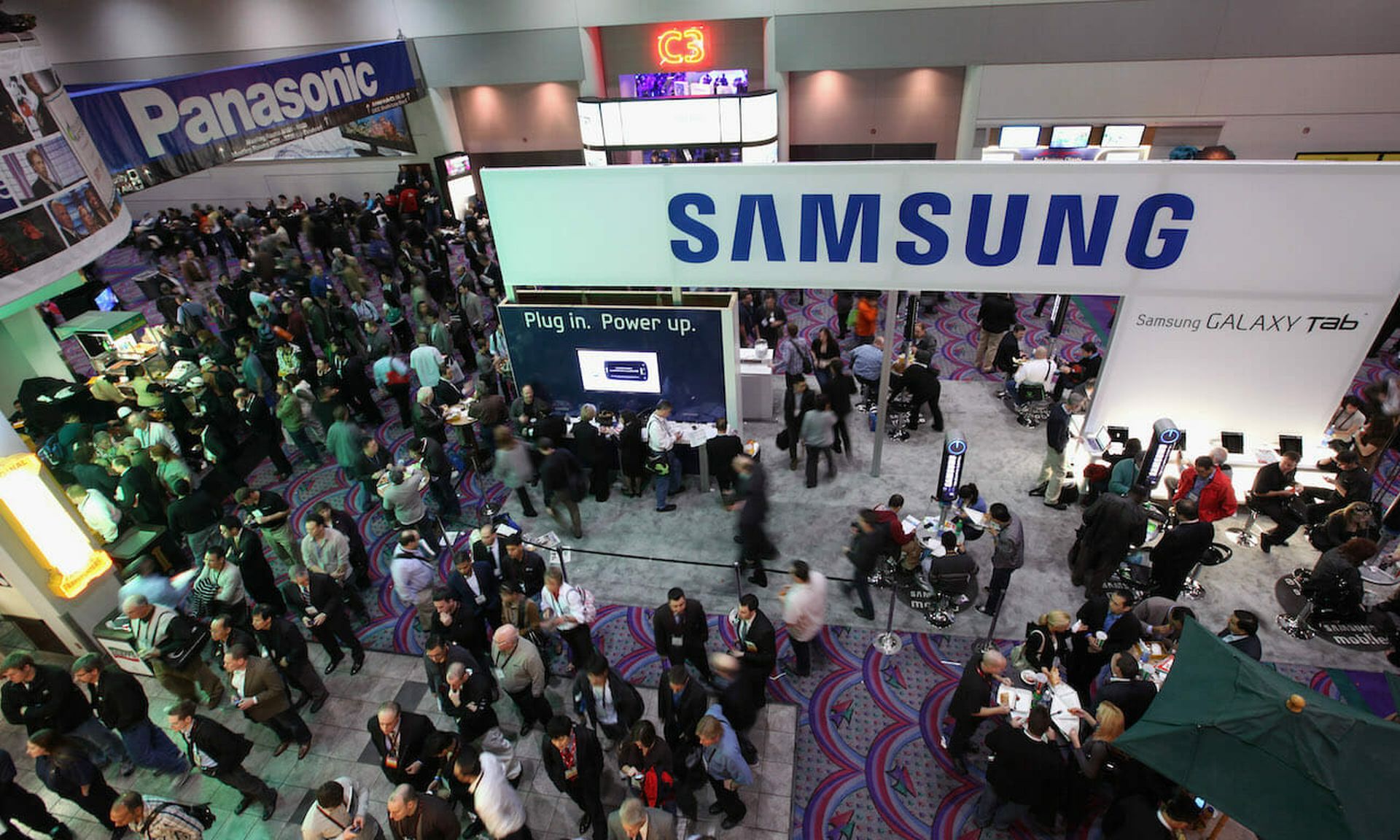 CES attendees move through the show floor during the International Consumer Electronics Show, showcasing the latest in consumer technology and devices. A study finds a correlation between how companies handle security of IoT devices and other aspects of their IT infrastructure. (Justin Sullivan/Getty Images)