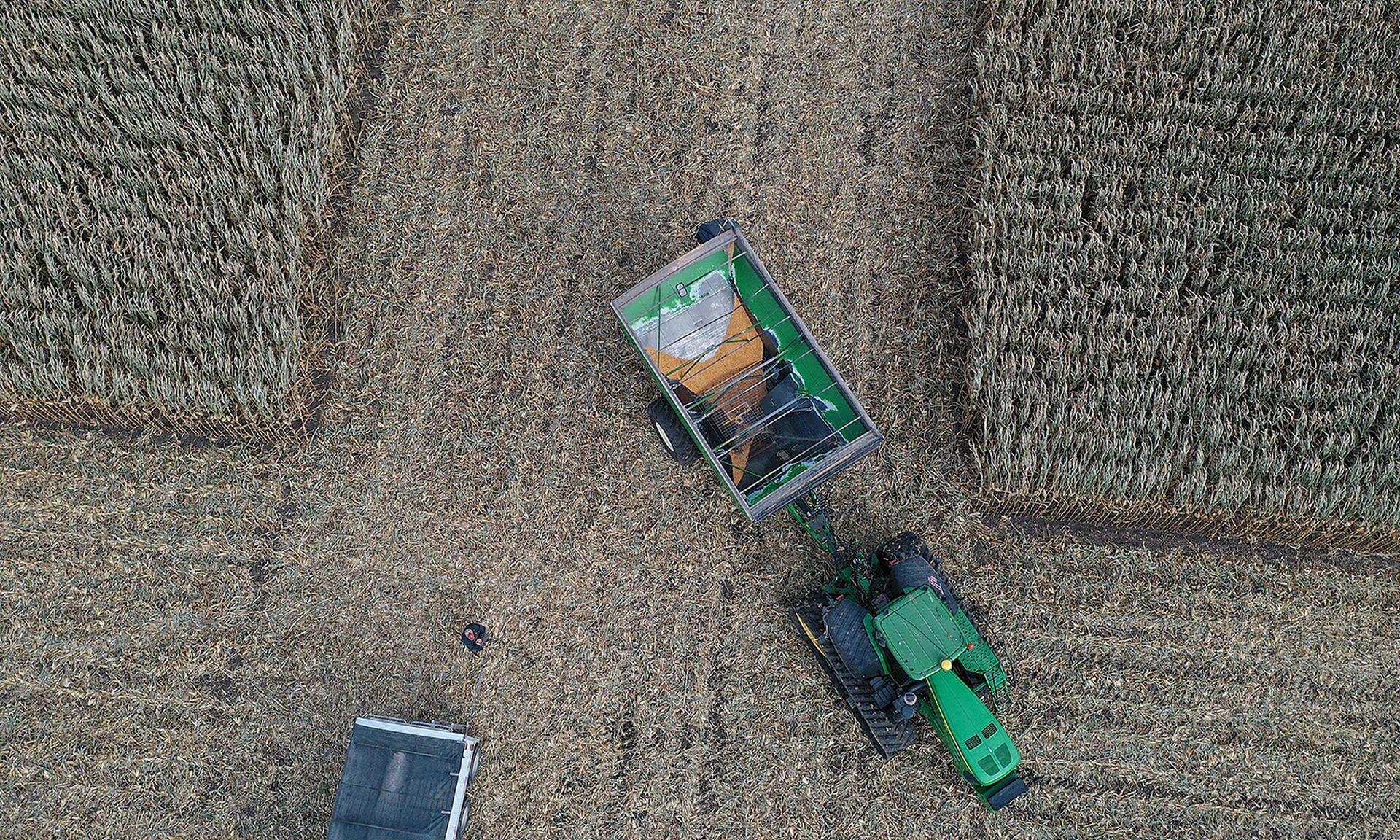 An aerial view from a drone shows a grain cart being used during the corn harvest in a field at the Hansen Family Farms on Oct. 12, 2019, in Baxter, Iowa. (Photo by Joe Raedle/Getty Images)