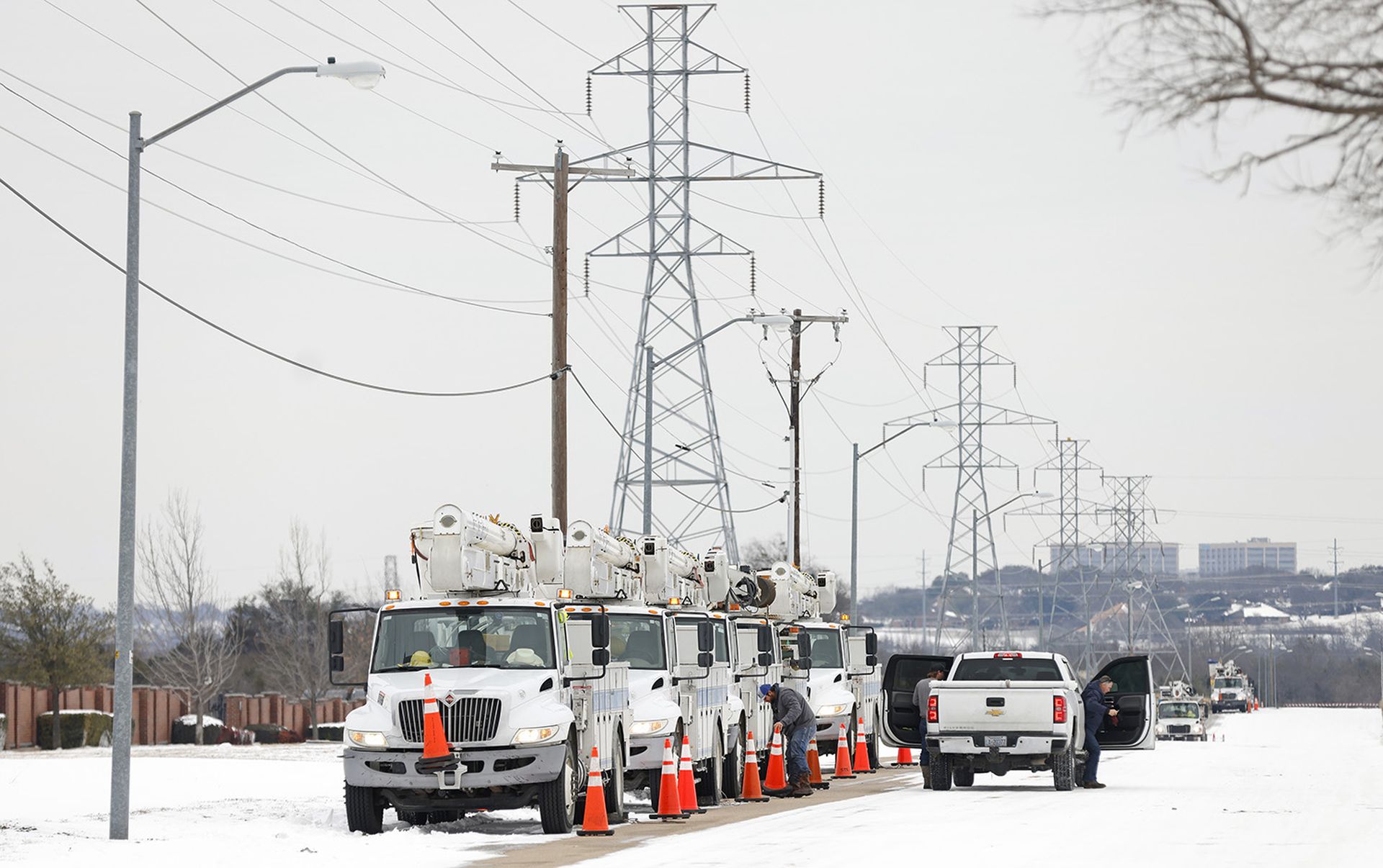 Pike Electric service trucks line up after a snow storm Feb. 16, 2021, in Fort Worth, Texas. (Photo by Ron Jenkins/Getty Images)
