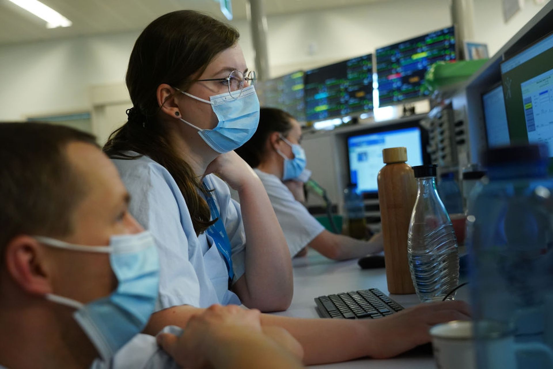 Hospital staff sit at computer monitors as monitors placed above show data from individual patients in the COVID intensive care unit at Leipzig university hospital (Universitaetsklinikum Leipzig) during the second wave of the coronavirus pandemic on January 12, 2021 in Leipzig, Germany. The hospital currently has 43 Covid patients in intensive care...