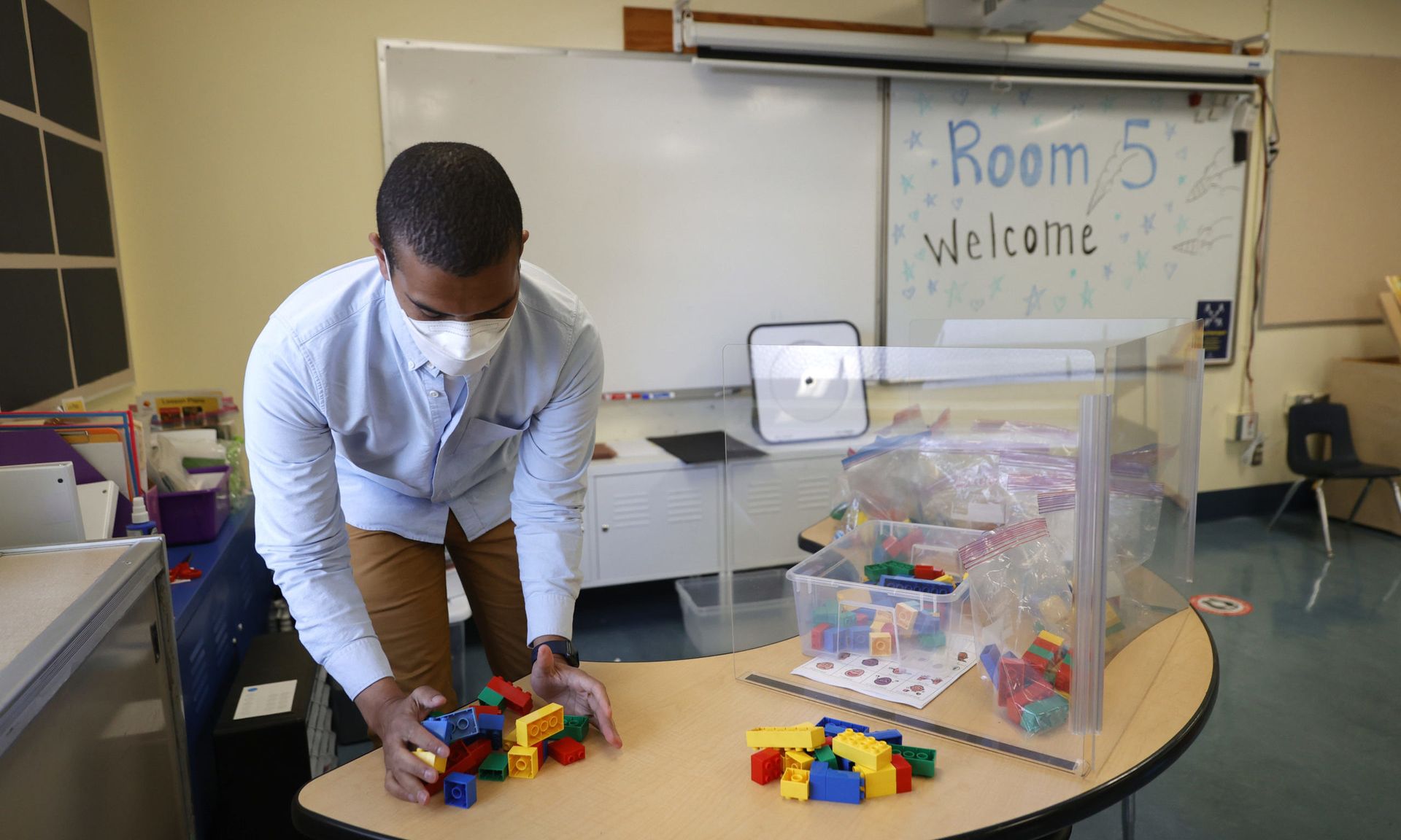 Bryant Elementary School kindergarten teacher Chris Johnson sets up his classroom on April 09, 2021 in San Francisco, California. The San Francisco Unified School District is preparing to gradually return students back to classrooms next week. (Photo by Justin Sullivan/Getty Images)