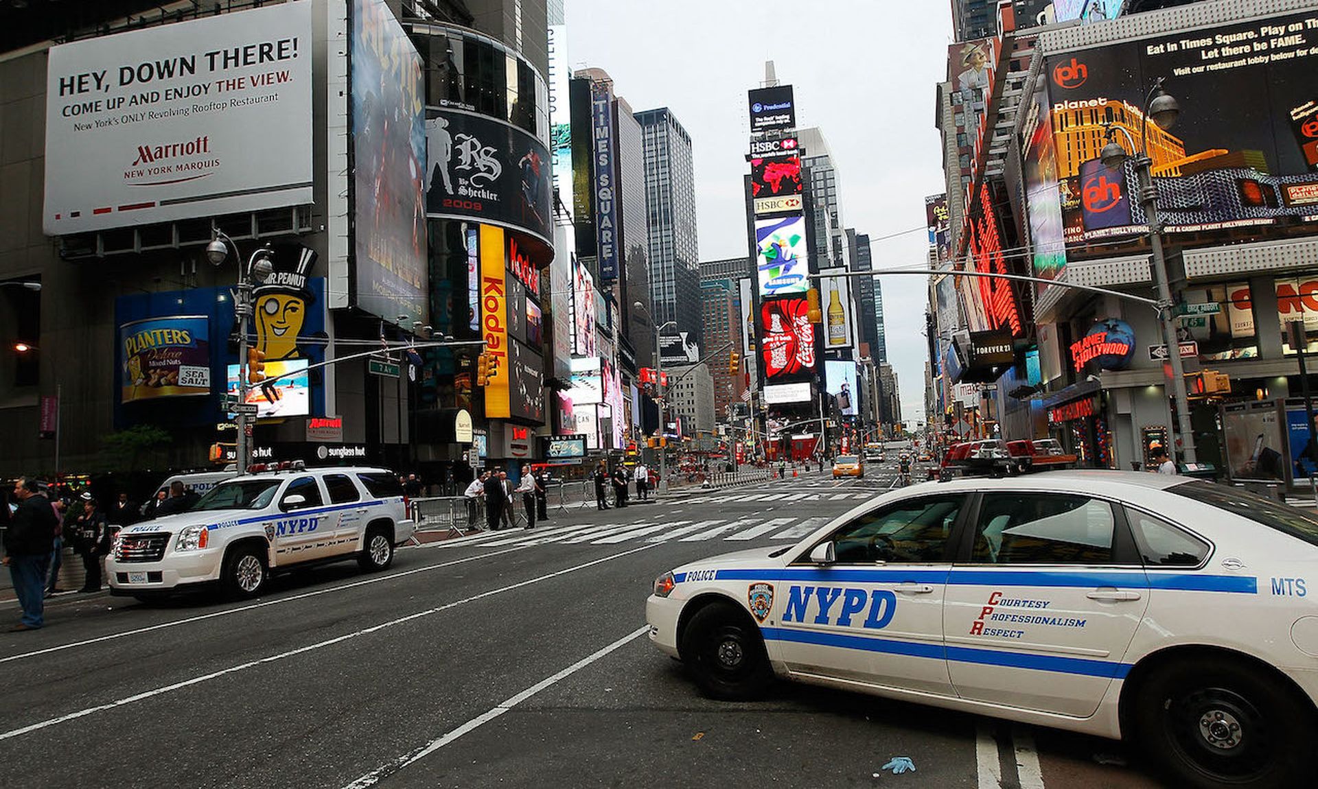 Police cruisers stand by at sunrise in Times Square May 2, 2010 in New York, New York. (Photo by Chris Hondros/Getty Images)