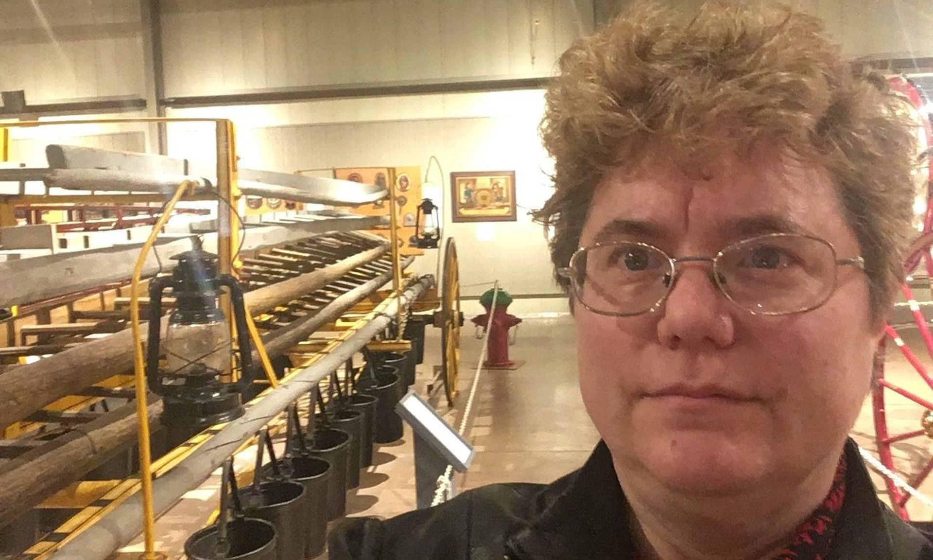 April Murdoch of Seattle Public Schools poses at a local museum. She notes that K-12 is a bit behind the times when it comes to cybersecurity, but making progress.