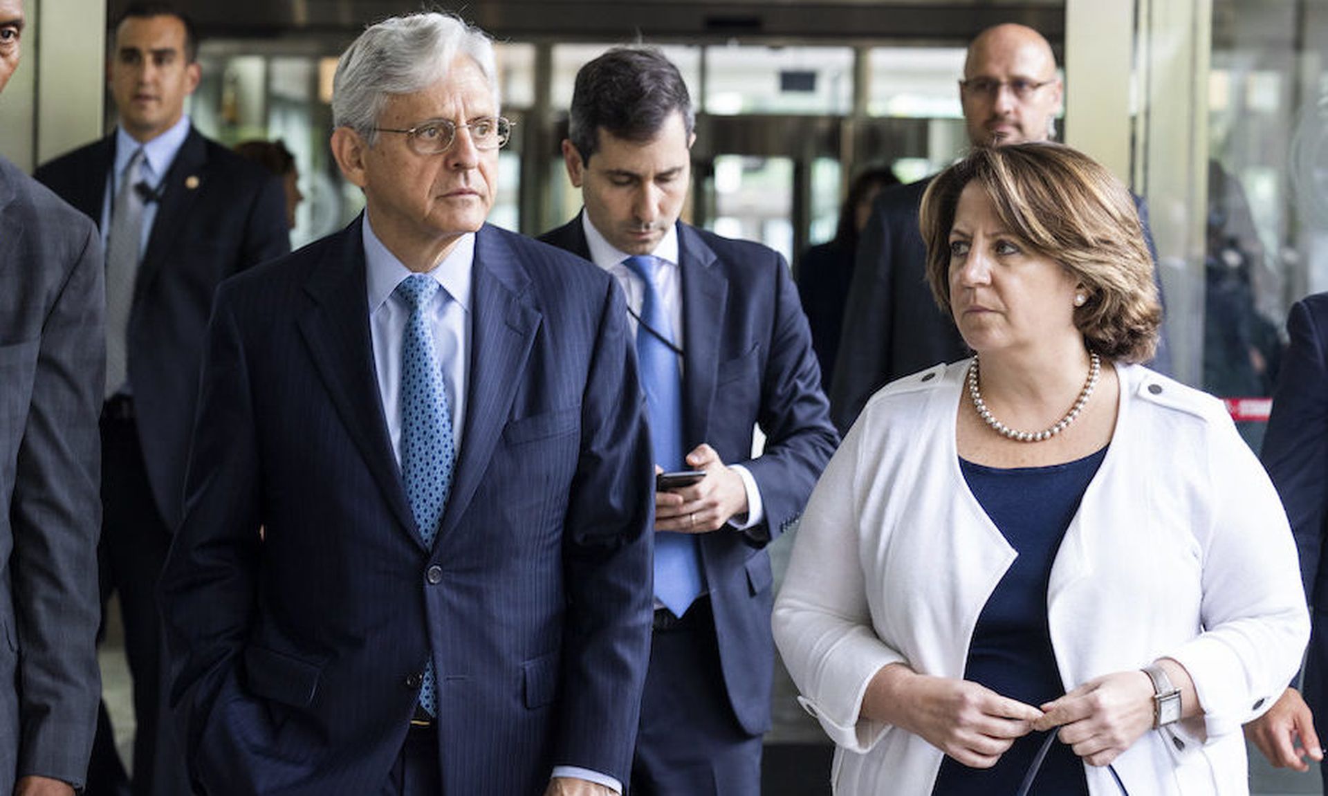 Attorney General Merrick Garland, center, along with Deputy Attorney General Lisa Monaco, right, in Washington. Monaco announced two new efforts focused on cryptocurrency and contractor security. (Photo by Jim Lo Scalzo &#8211; Pool/Getty Images)