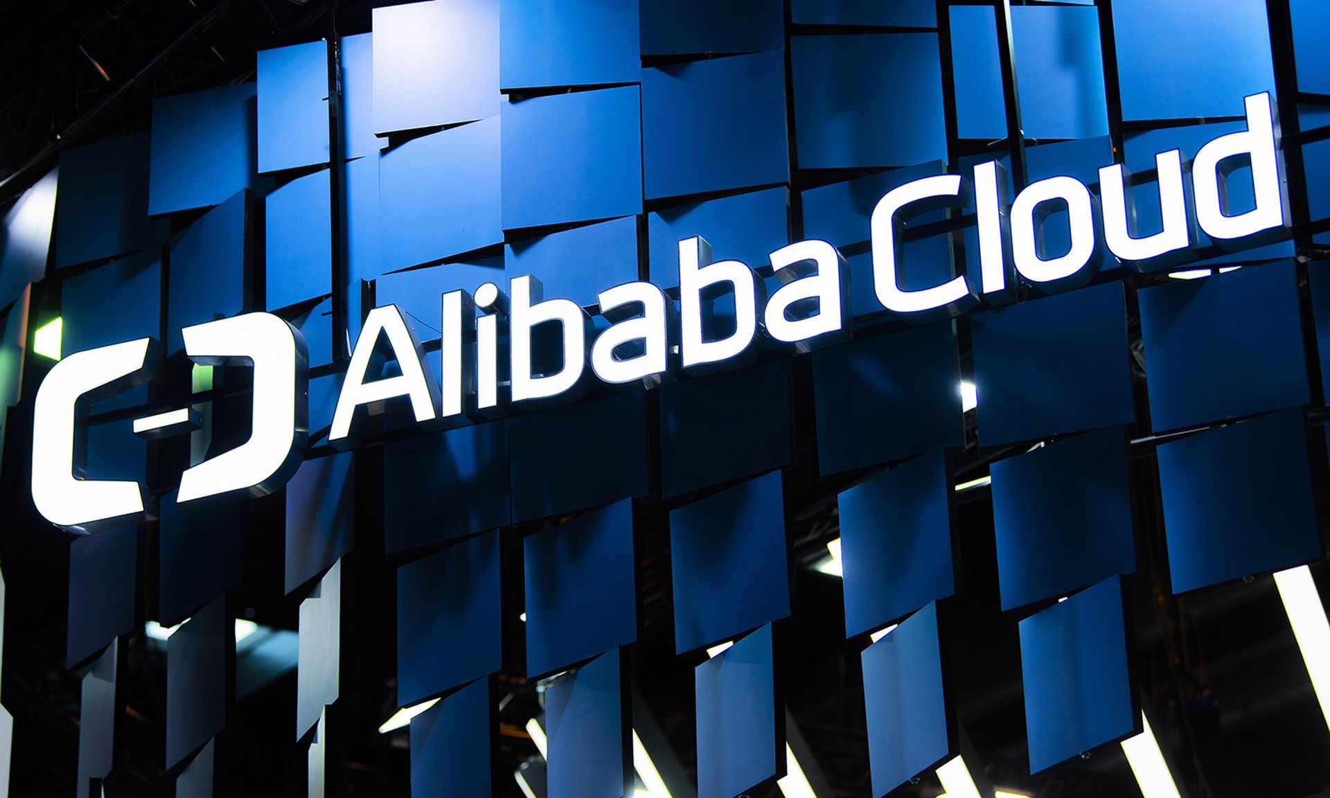 A logo sits illuminated outside the Alibaba Cloud booth on day 2 of the GSMA Mobile World Congress 2019 on Feb. 26, 2019, in Barcelona, Spain. (Photo by David Ramos/Getty Images)