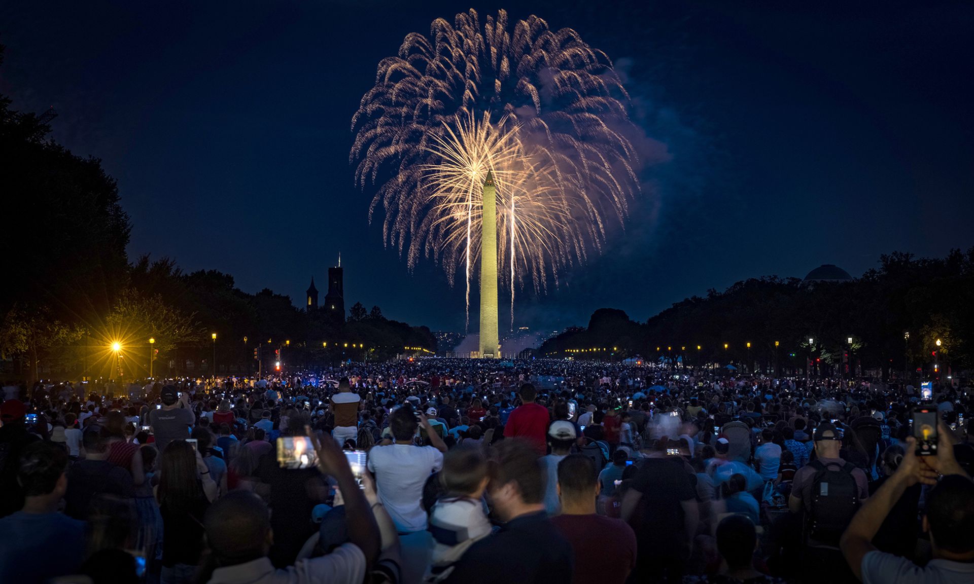 People fill the National Mall to watch the fireworks display during Independence Day celebrations on July 4, 2021, in Washington. (Photo by Samuel Corum/Getty Images)