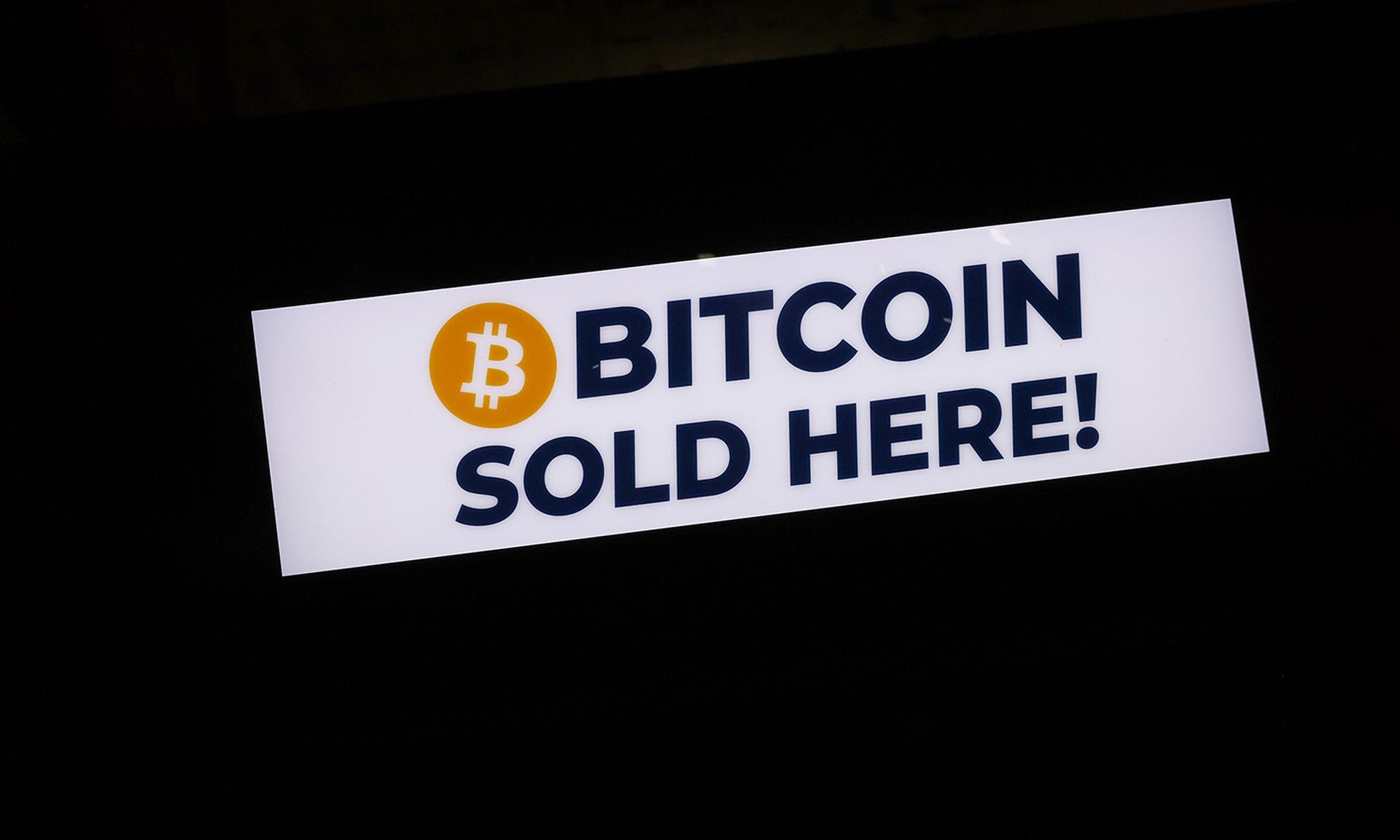 A sign reads &#8216;Bitcoin sold here!&#8217; on June 4 at the Bitcoin 2021 Convention at the Mana Convention Center in Miami. (Photo by Joe Raedle/Getty Images)