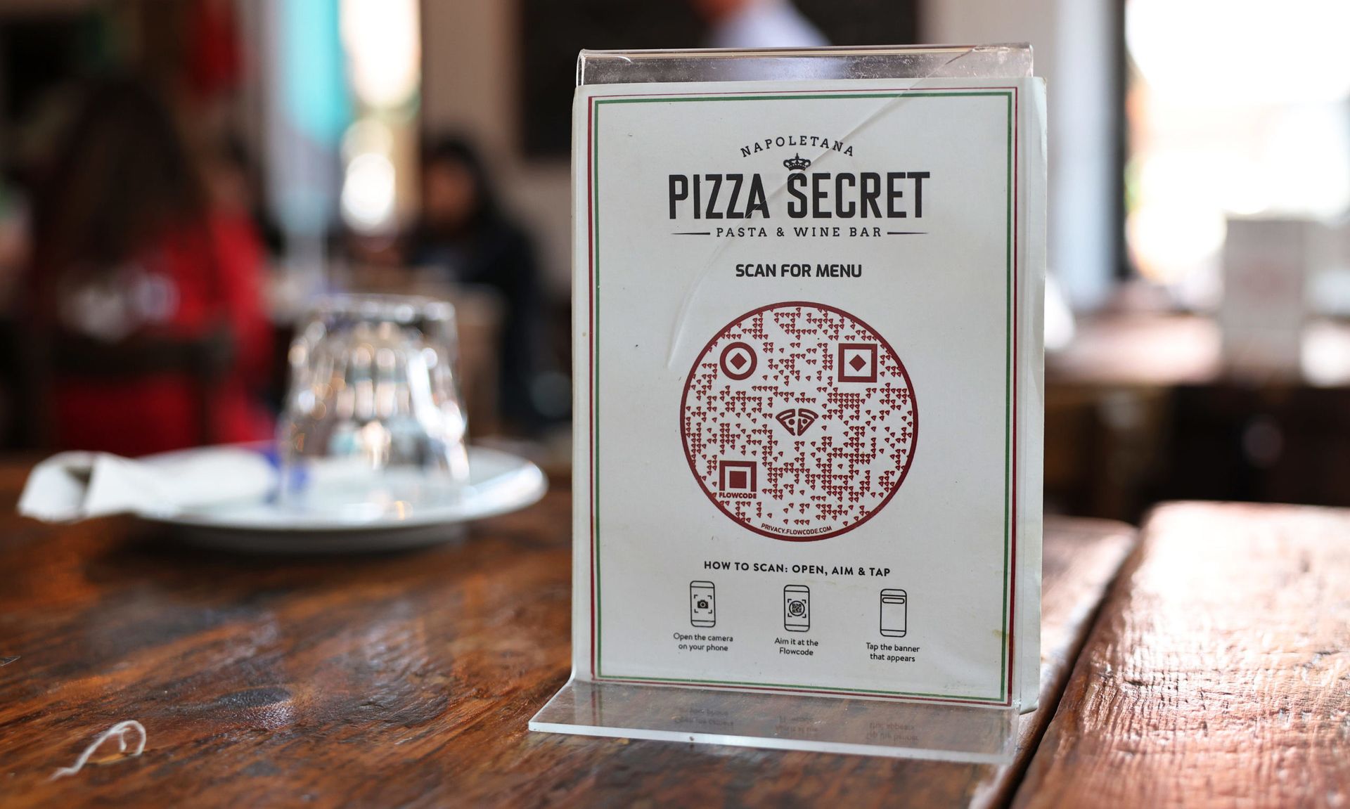 NEW YORK, NEW YORK &#8211; JULY 27: A QR code menu is seen on a table at Pizza Secret on July 27, 2021 in the Park Slope neighborhood of the Brooklyn borough in New York City. According to the National Restaurant Association, half of all full-service restaurants in America have added QR code menus since the start of the coronavirus (COVID-19) pande...