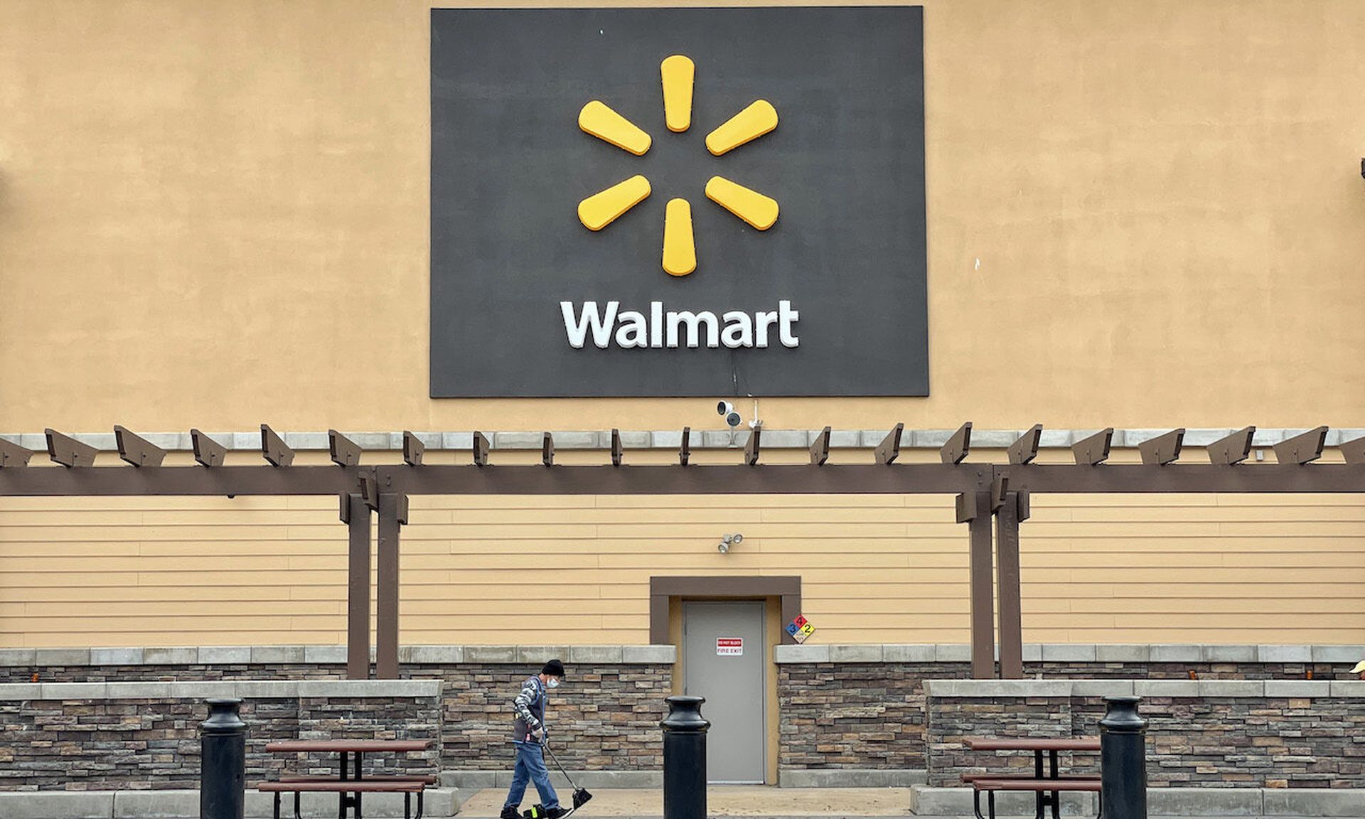 A sign is posted in front of a Walmart store on November 16, 2021 in American Canyon, California. (Photo by Justin Sullivan/Getty Images)