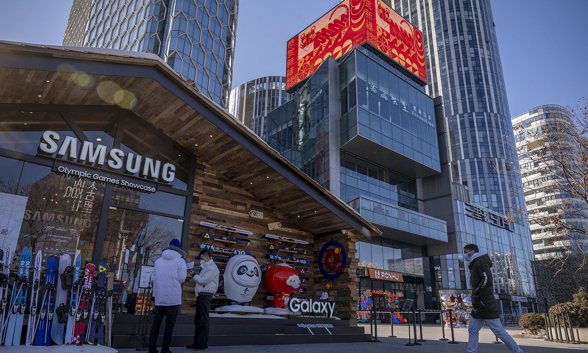 Electronics giant Samsung confirmed source code for its Galaxy devices was leaked after a data breach. Pictured: People stand in front of a Samsung exhibition with the theme of Winter Olympics in a shopping district of Beijing on Feb. 2, 2022, in Beijing, China. (Photo by Andrea Verdelli/Getty Images)