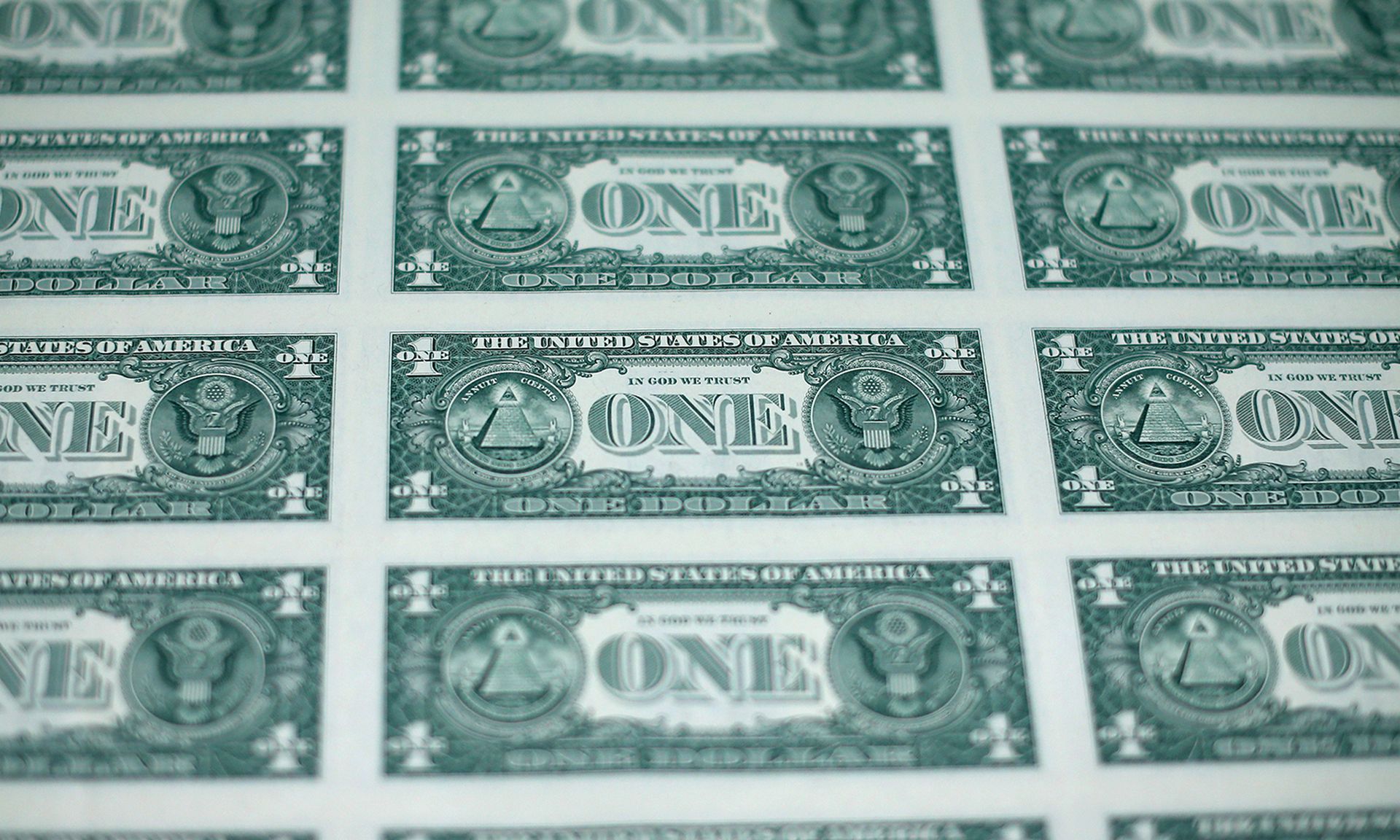 A sheet of freshly printed one dollar bills is ready for inspection at the Bureau of Engraving and Printing on March 24, 2015, in Washington. (Photo by Mark Wilson/Getty Images)