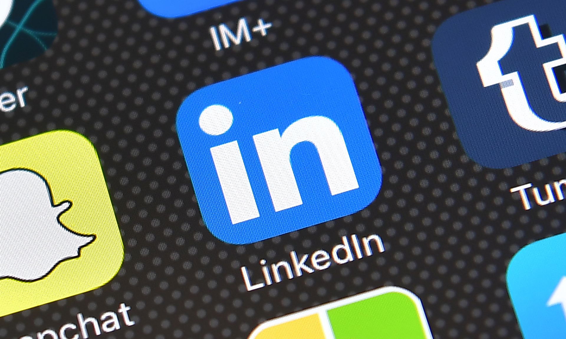 The LinkedIn app logo is displayed on an iPhone on Aug. 3, 2016, in London. (Photo by Carl Court/Getty Images)