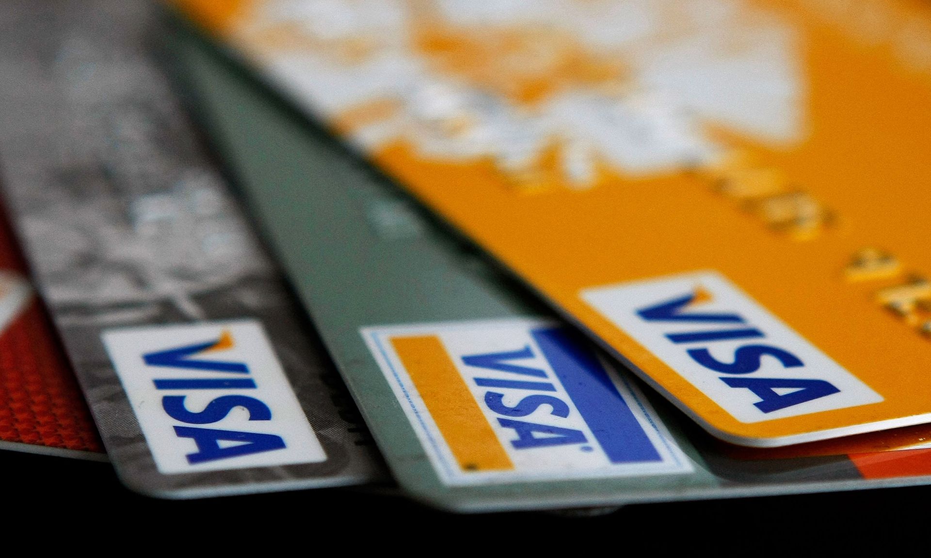 Visa credit cards are arranged on a desk Feb. 25, 2008, in San Francisco. (Photo Illustration by Justin Sullivan/Getty Images)