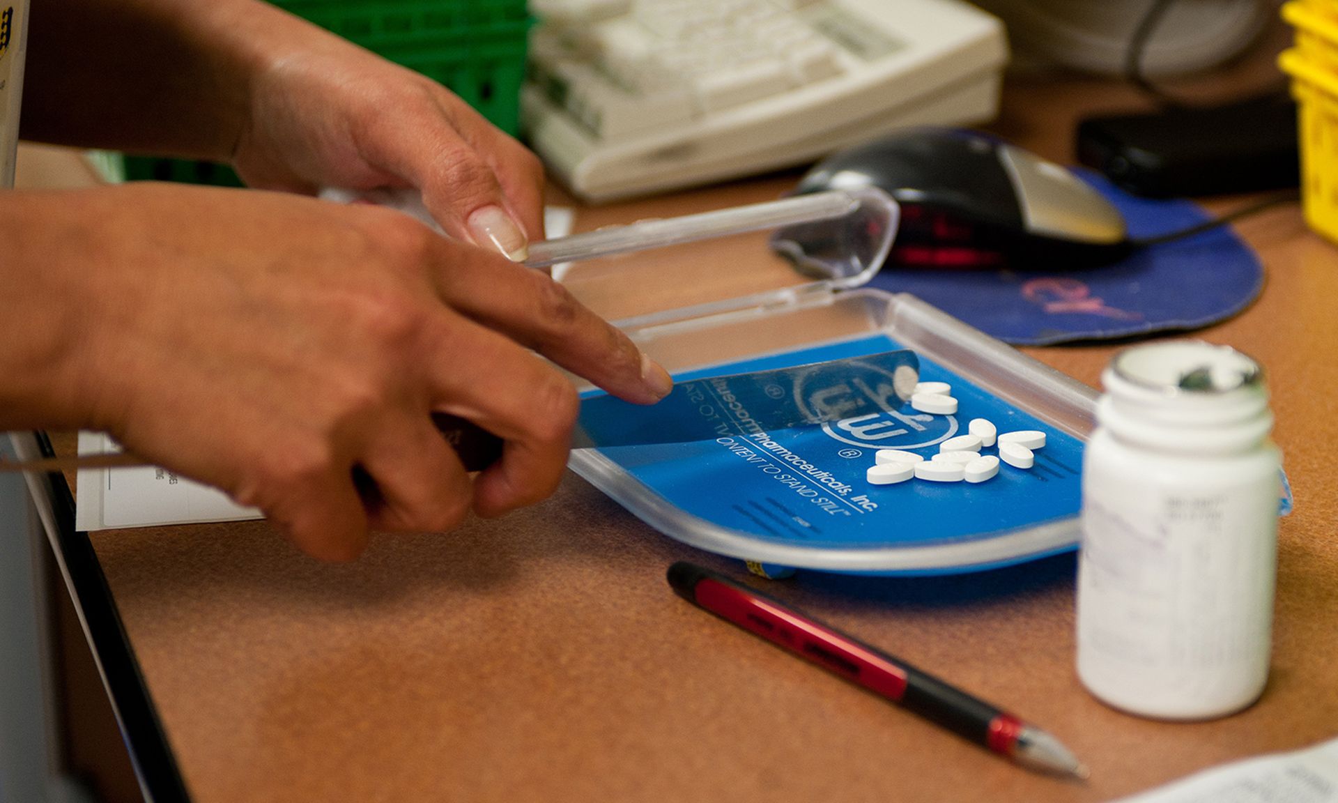 An Air Force pharmacy technician counts pills to correctly fill a prescription on Ellsworth Air Force Base, S.D. (Air Force)