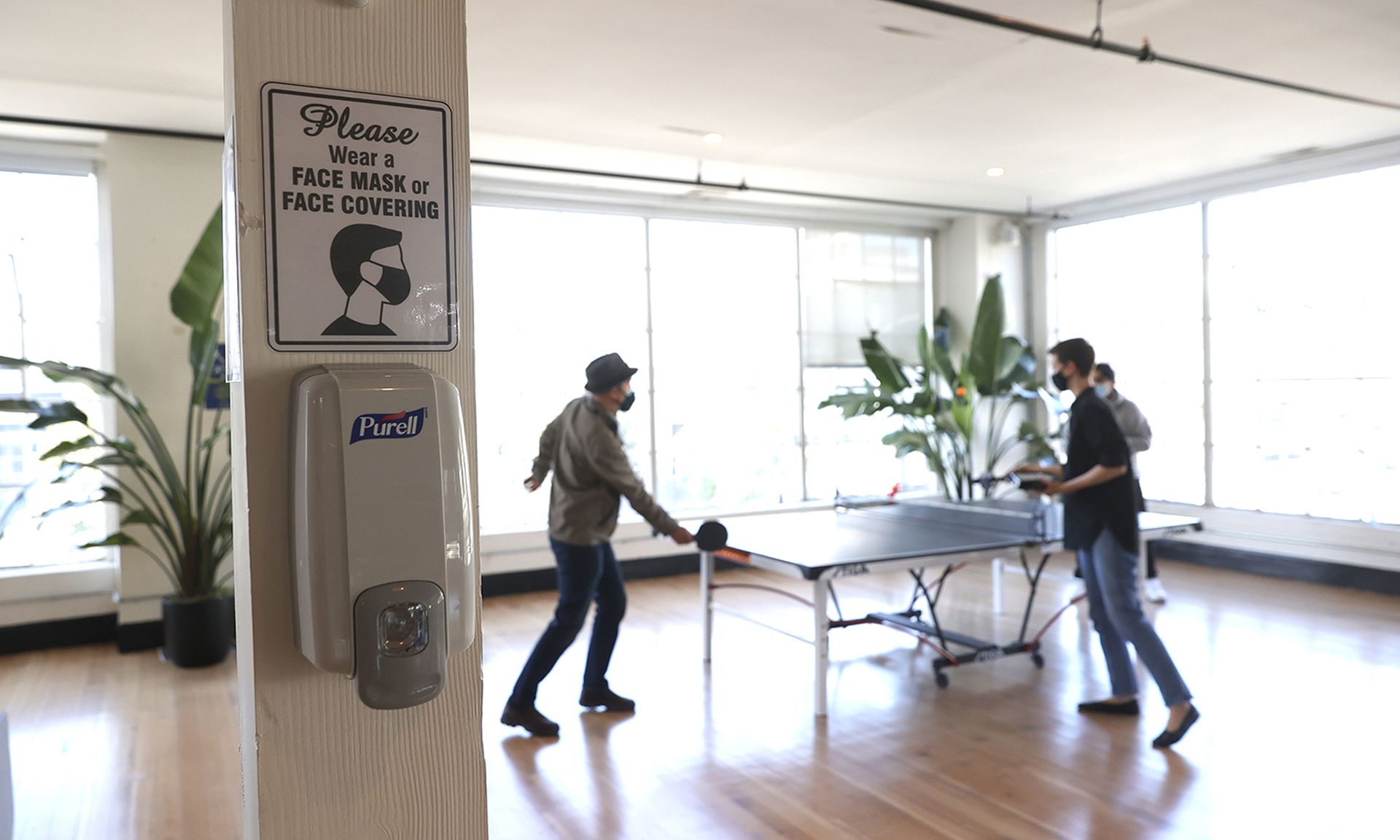 Employees play ping pong