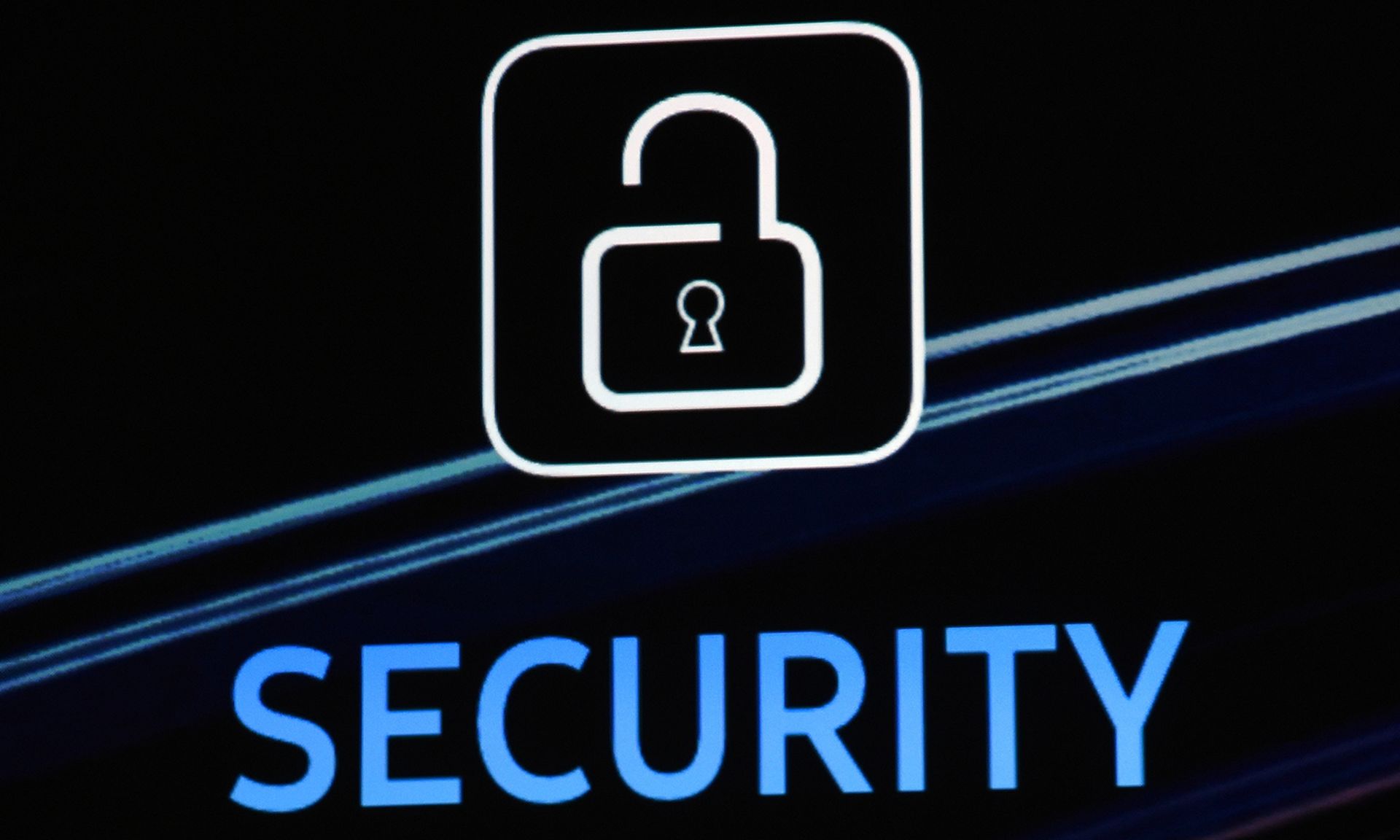 A security logo is shown on screen during a keynote address.