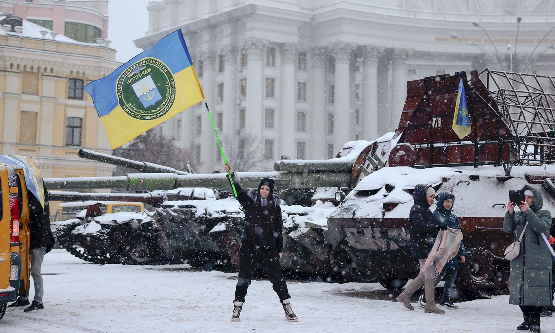 A protester waves a Ukrainian flag in Kyiv