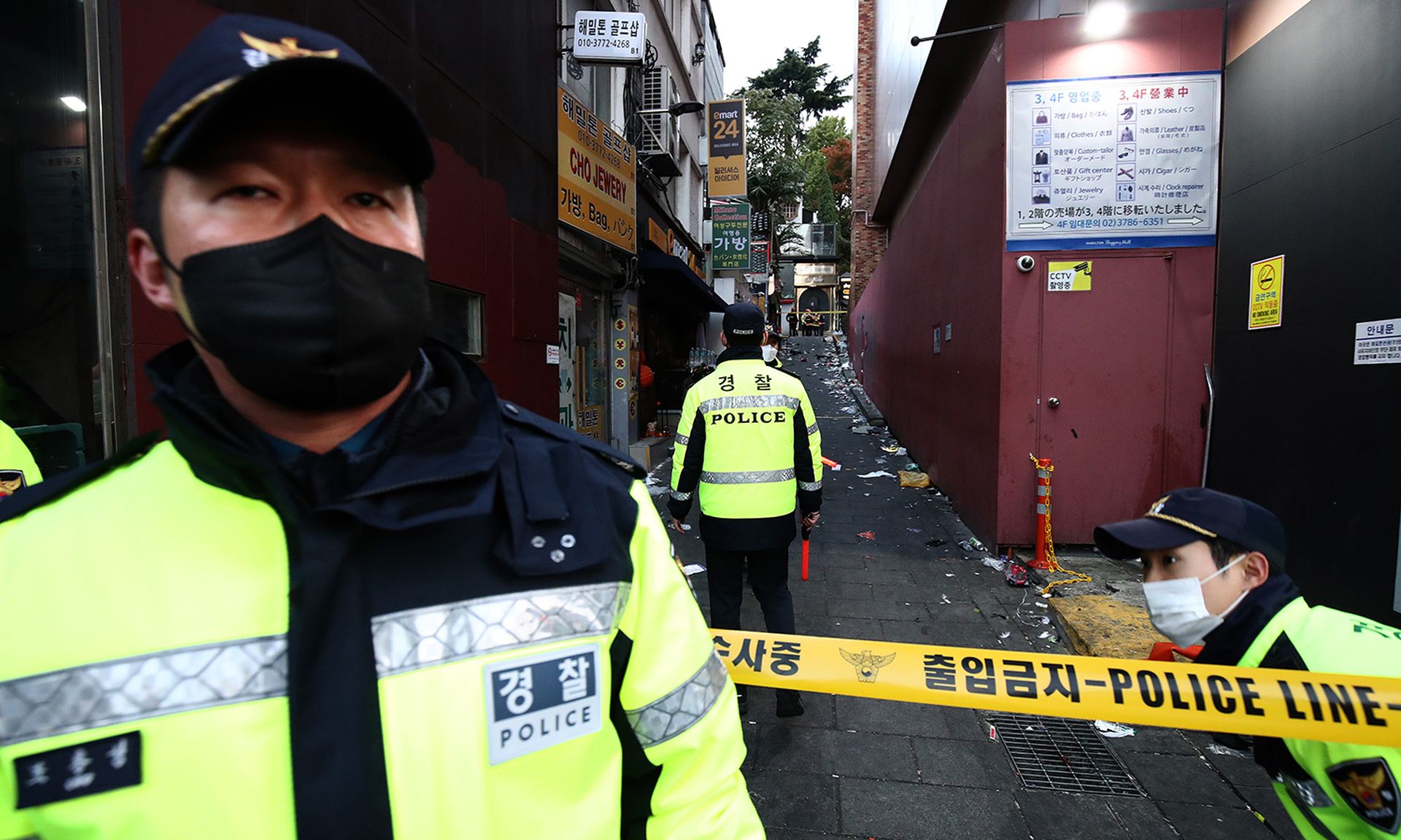 A South Korean policeman stands in front of police tape