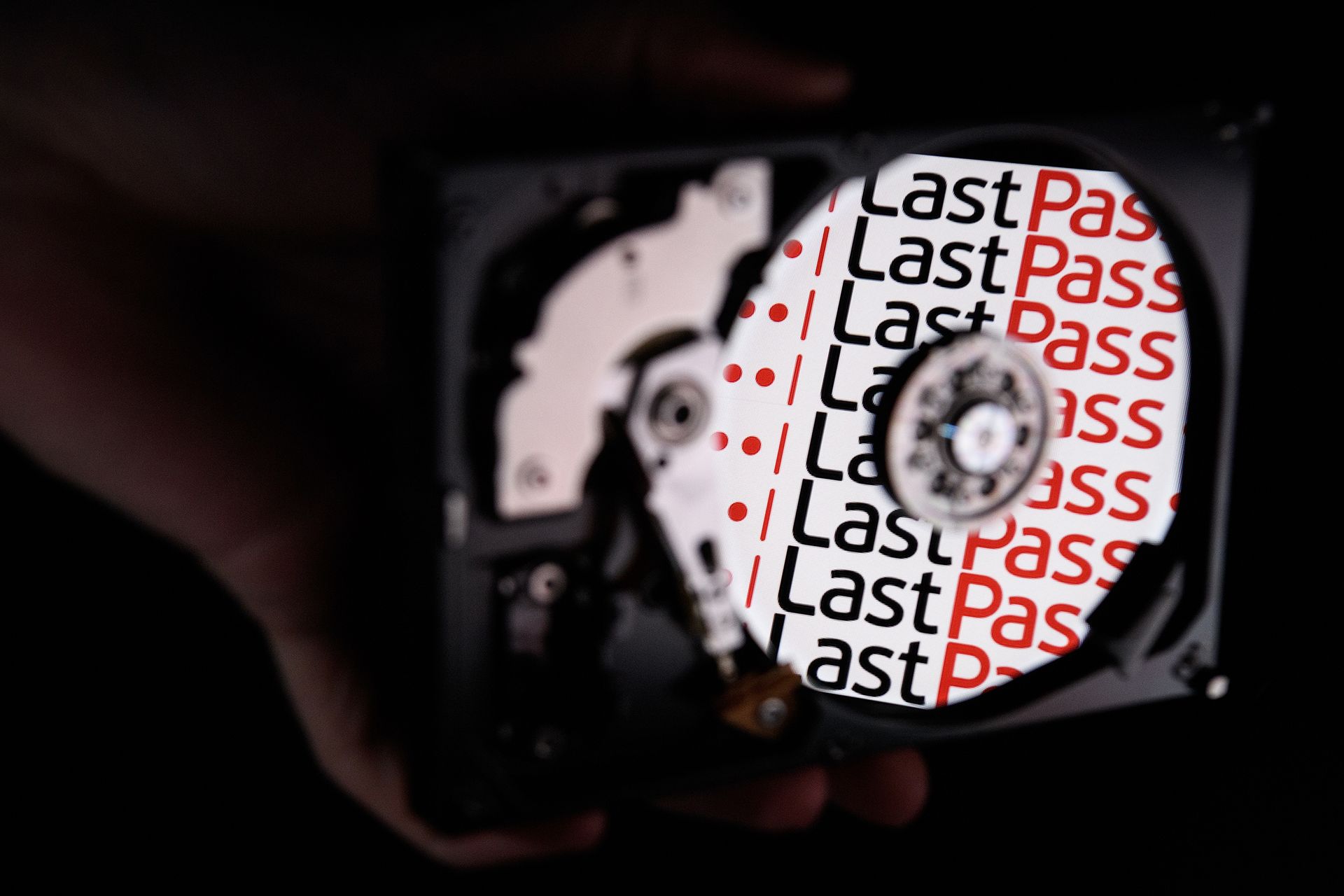 The logo for online password manager service LastPass is reflected on the internal discs of a hard drive.