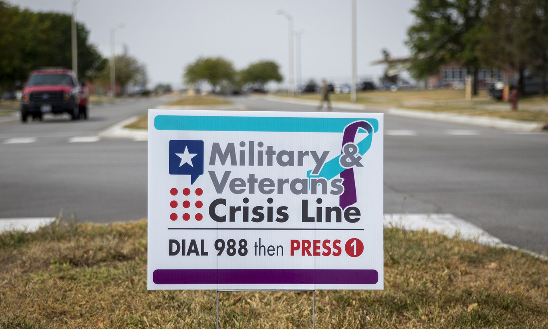 A sign for the Military and Veterans Crisis Line