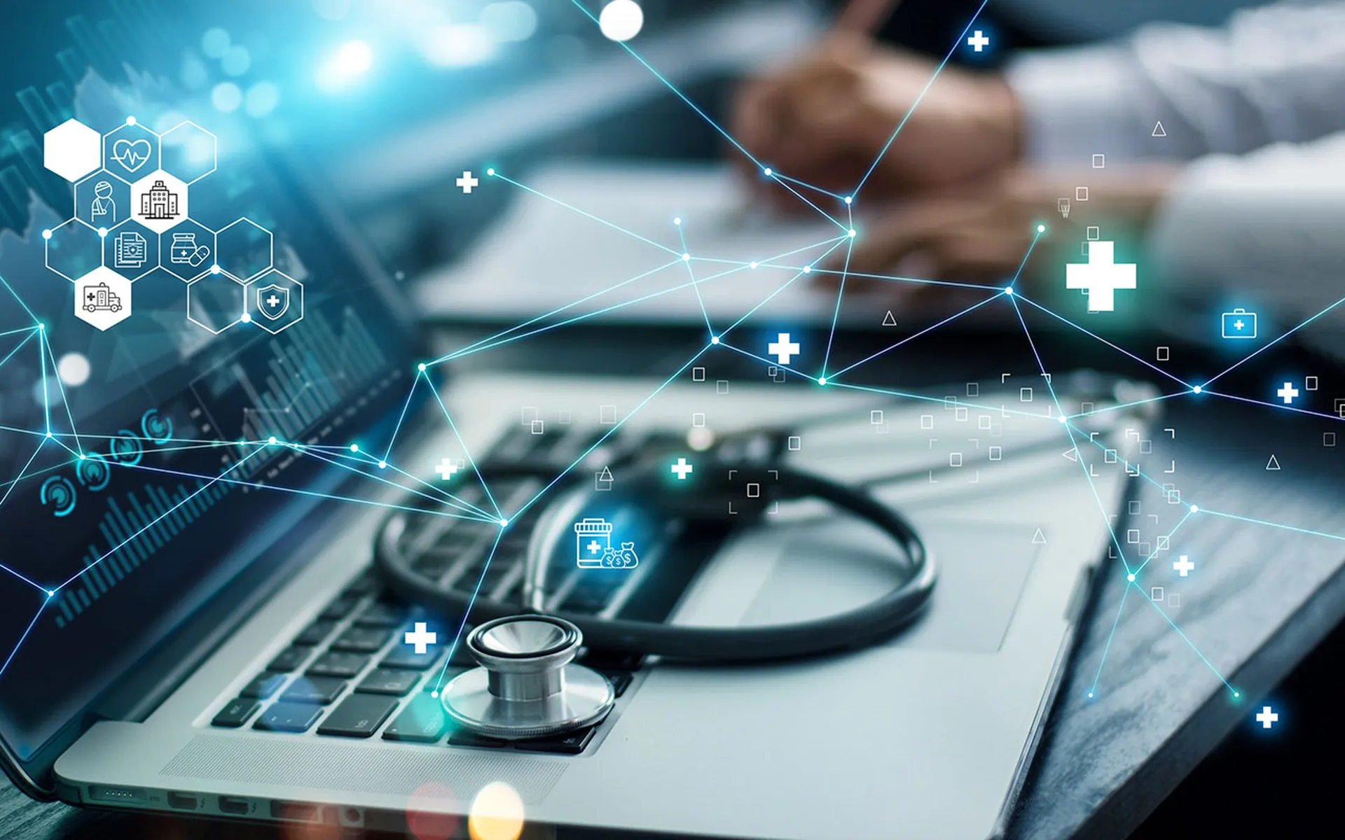 Healthcare business graph data and growth, Insurance Healthcare. Doctor analyzing medical of business report and medical examination with network connection on laptop screen. (iStock via Getty Images)
