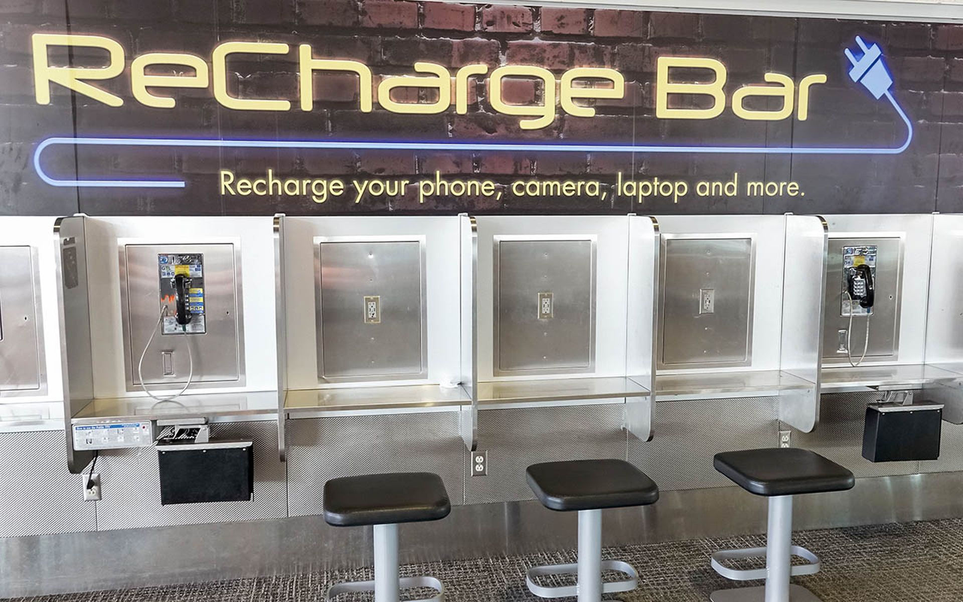Charging station for devices at an airport
