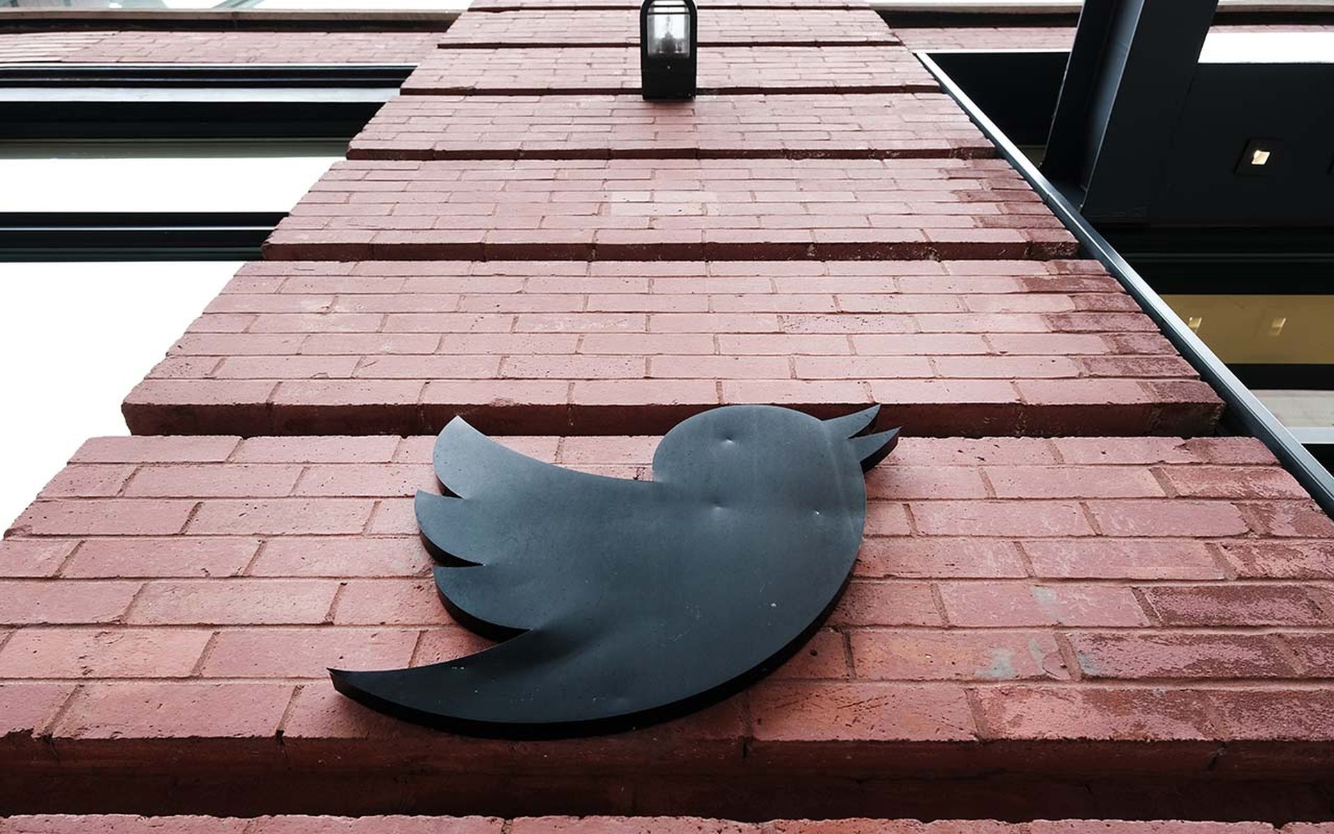 The Twitter logo is seen on a building